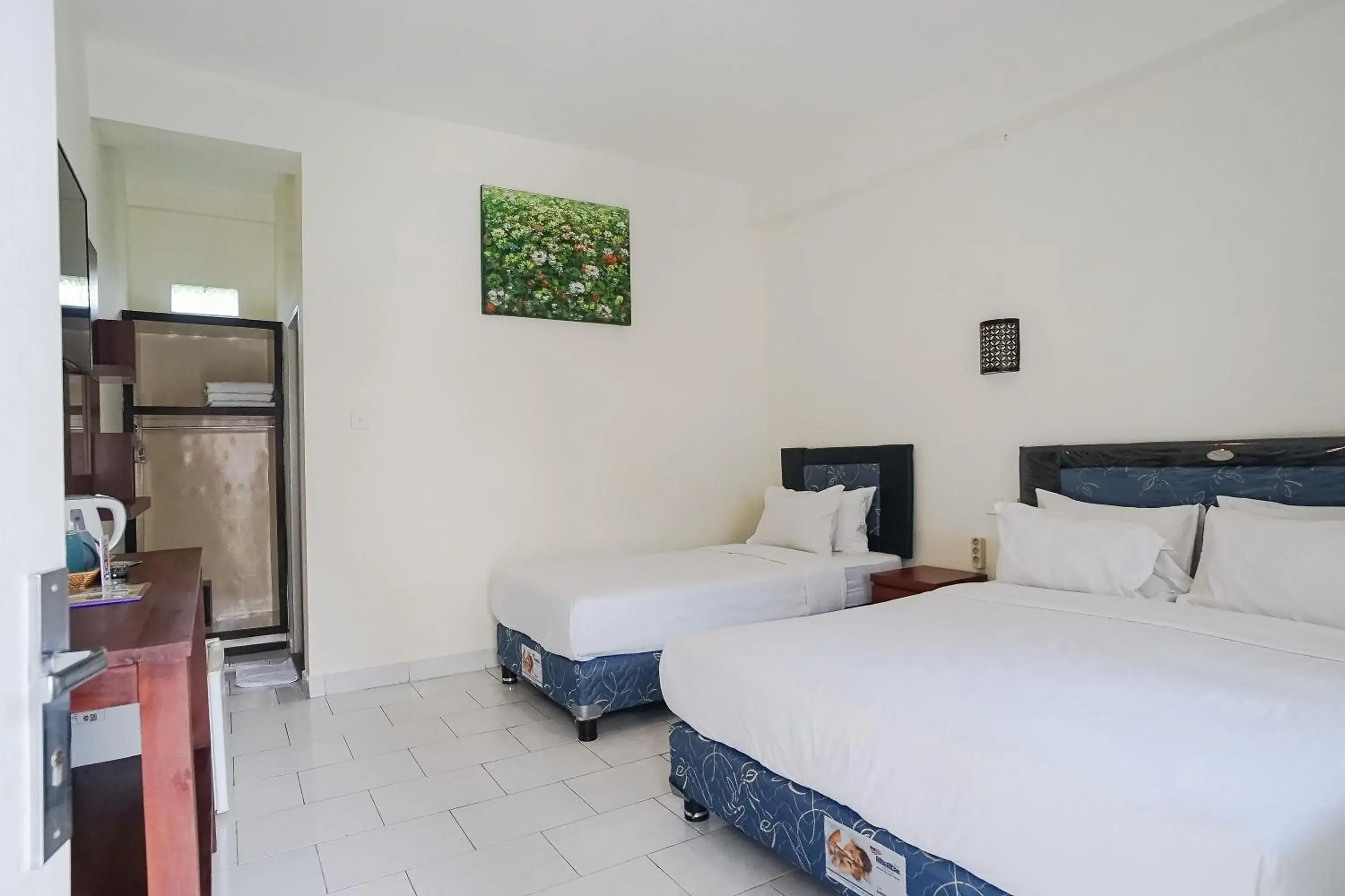 Bed in City Garden Bali Dwipa Hotel