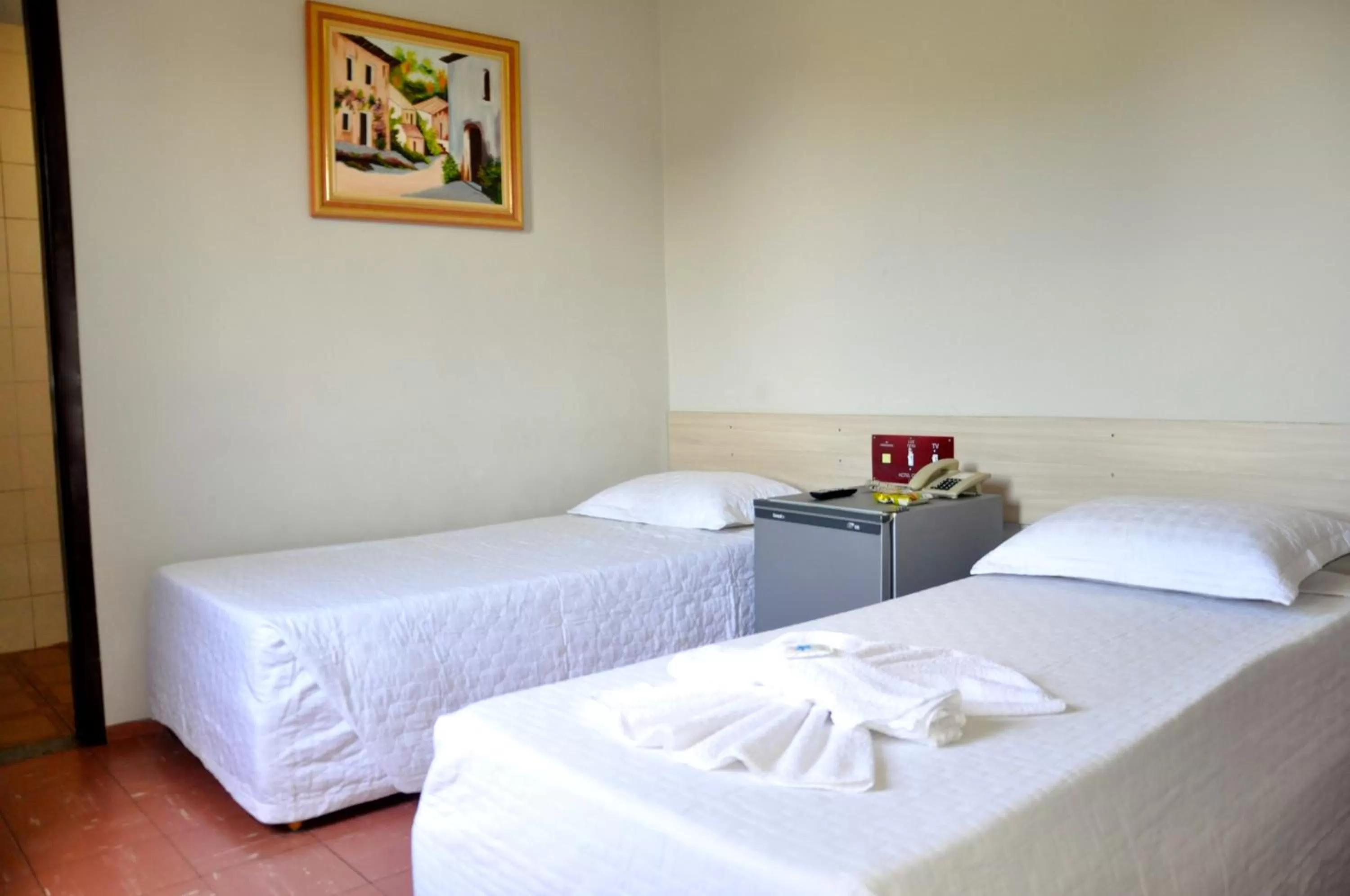 Bed in Hotel Caçula