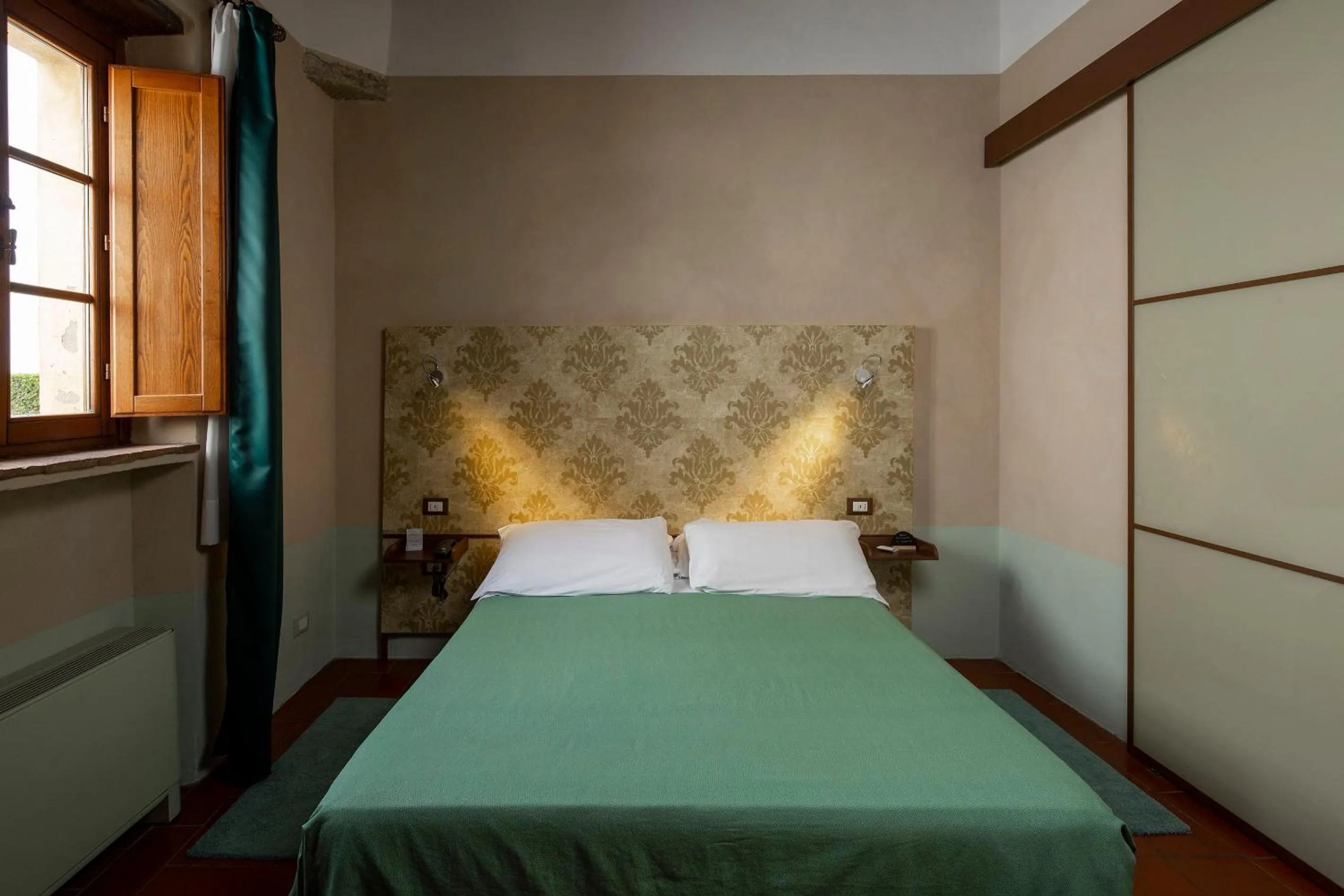 Bed in Hotel Le Capanne