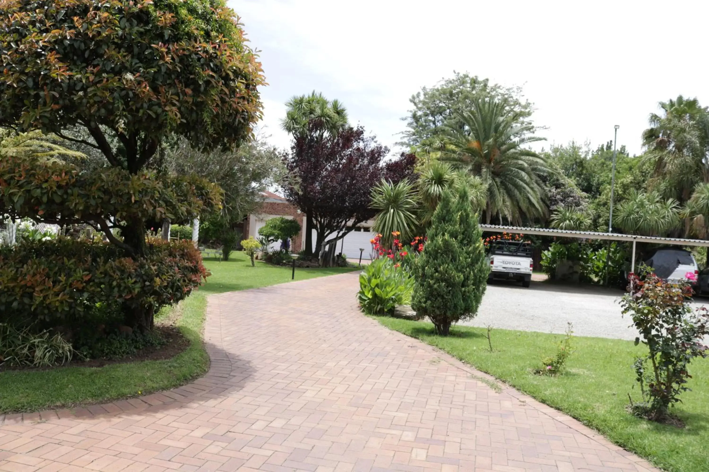 Property building, Garden in Airport Gardens Boutique Hotel