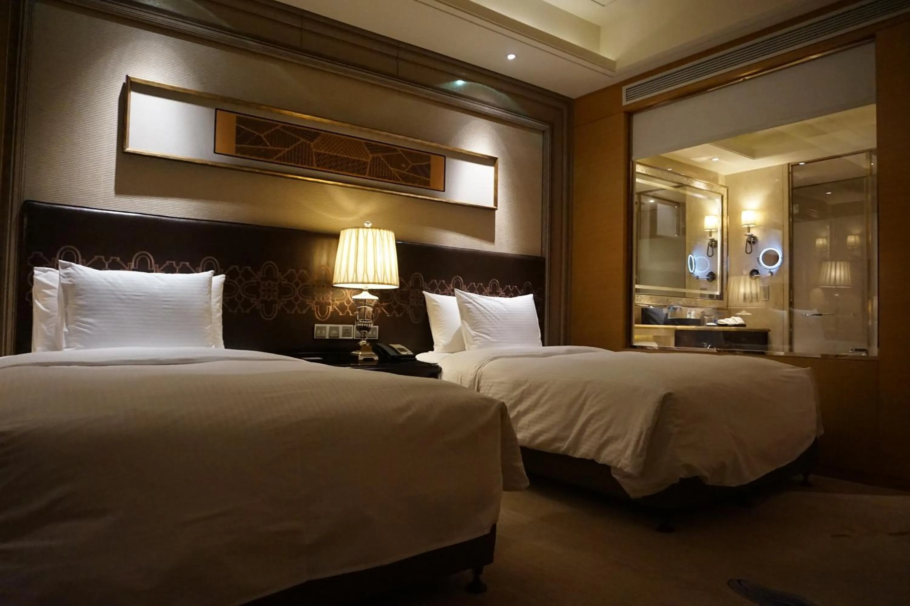 Bed in Wanda Realm Harbin Hotel