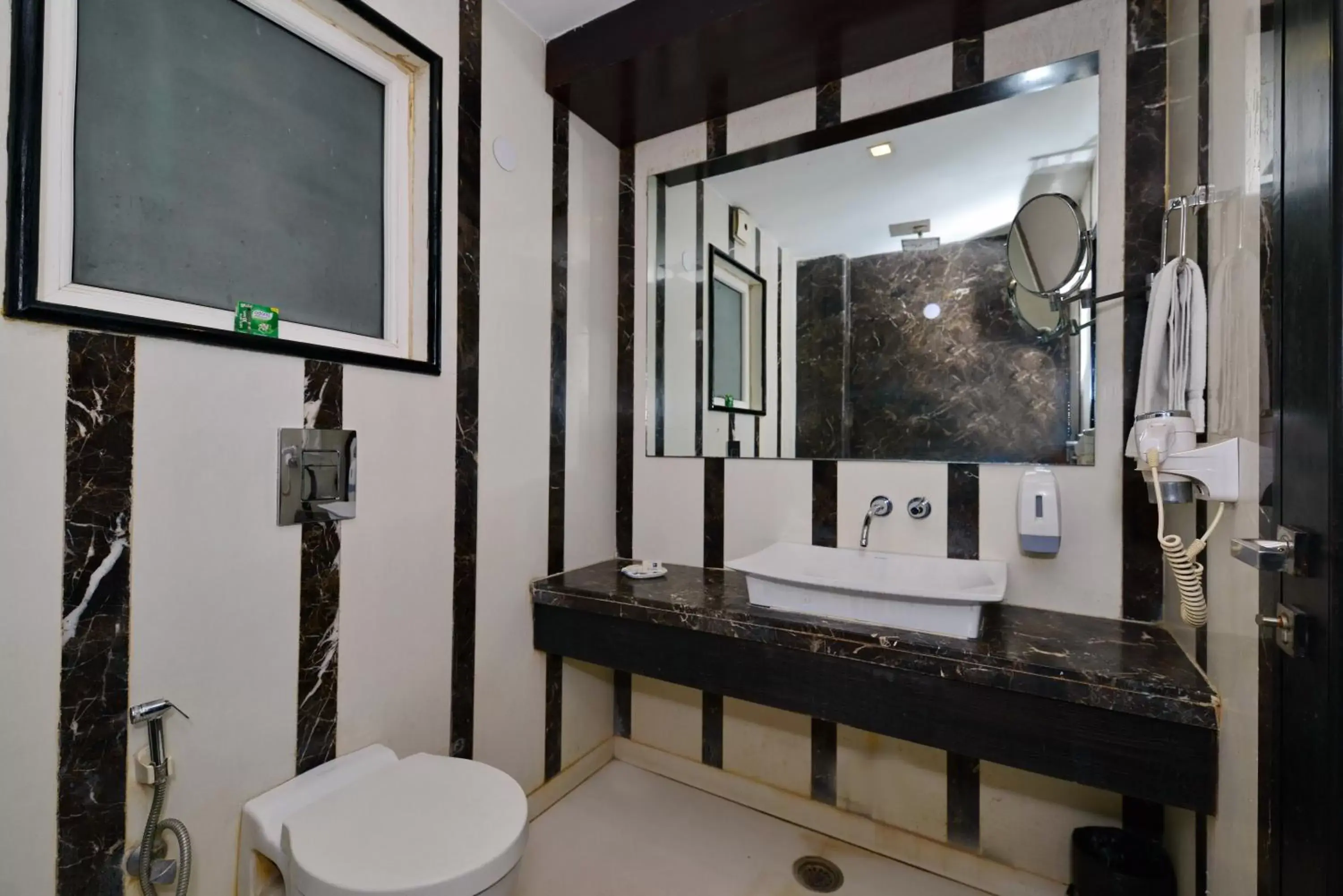 Bathroom in Hotel Krishna - By RCG Hotels