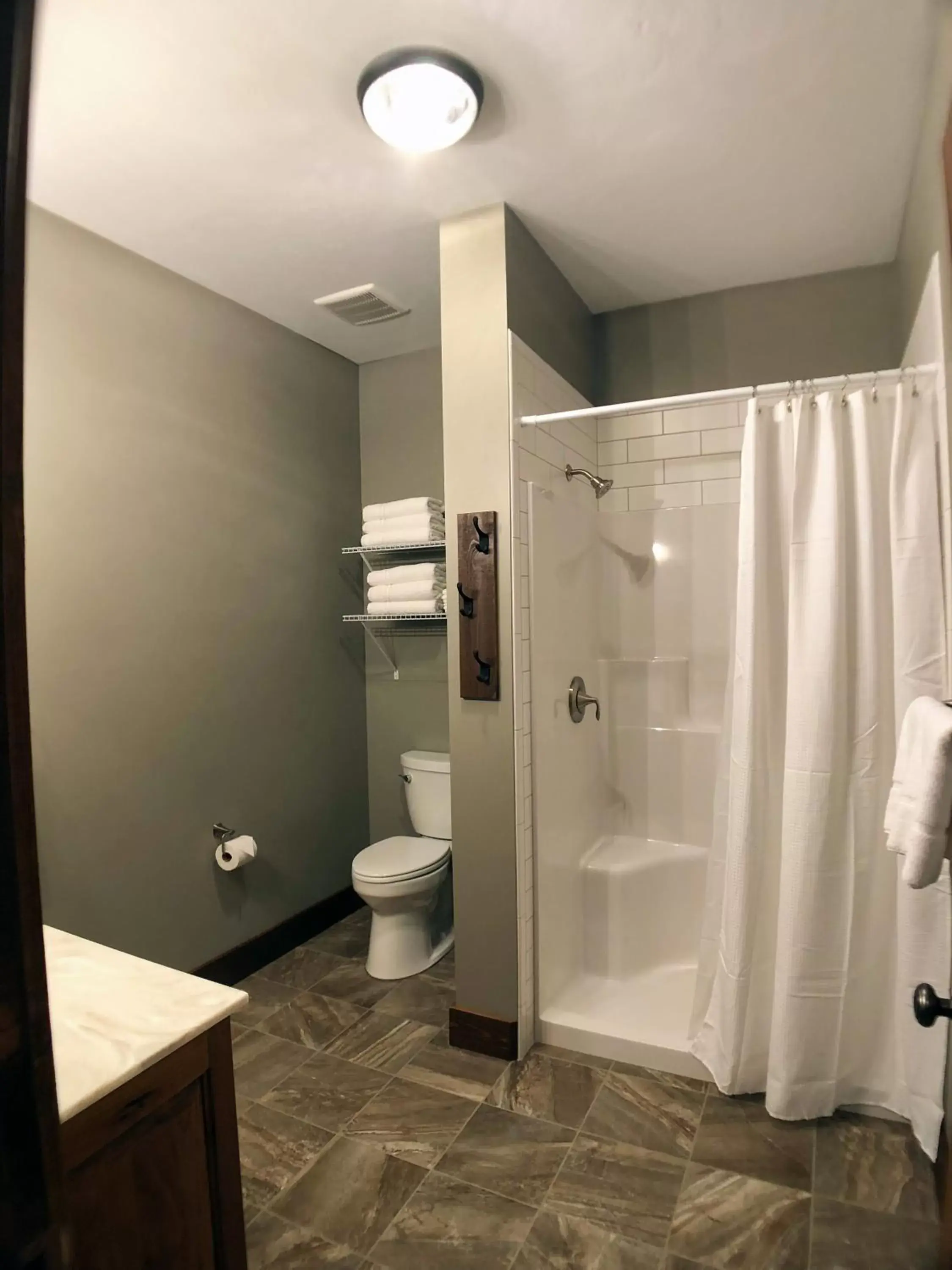 Bathroom in Sojourner's Lodge & Log Cabin Suites