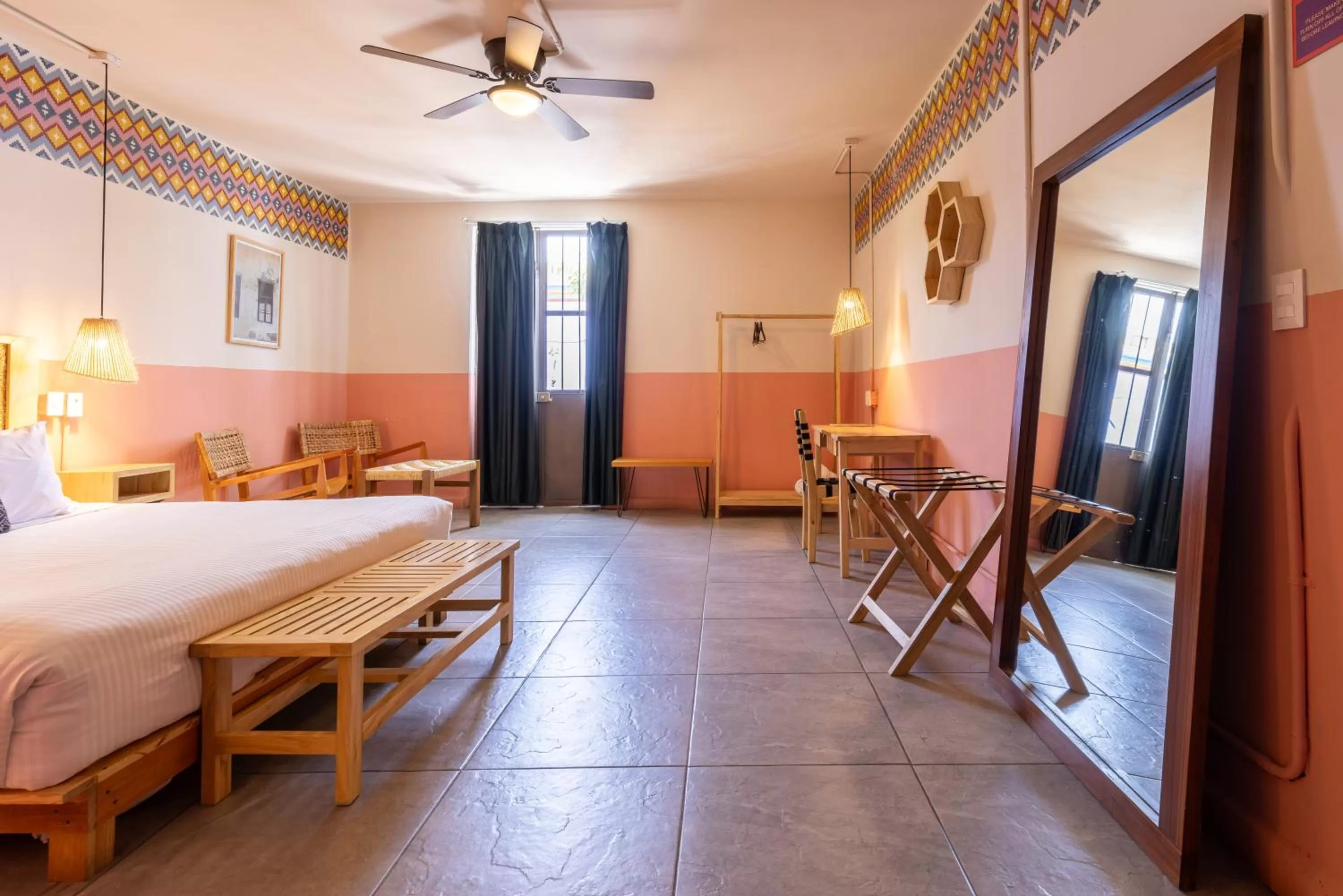 Seating area, Bed in Selina Oaxaca