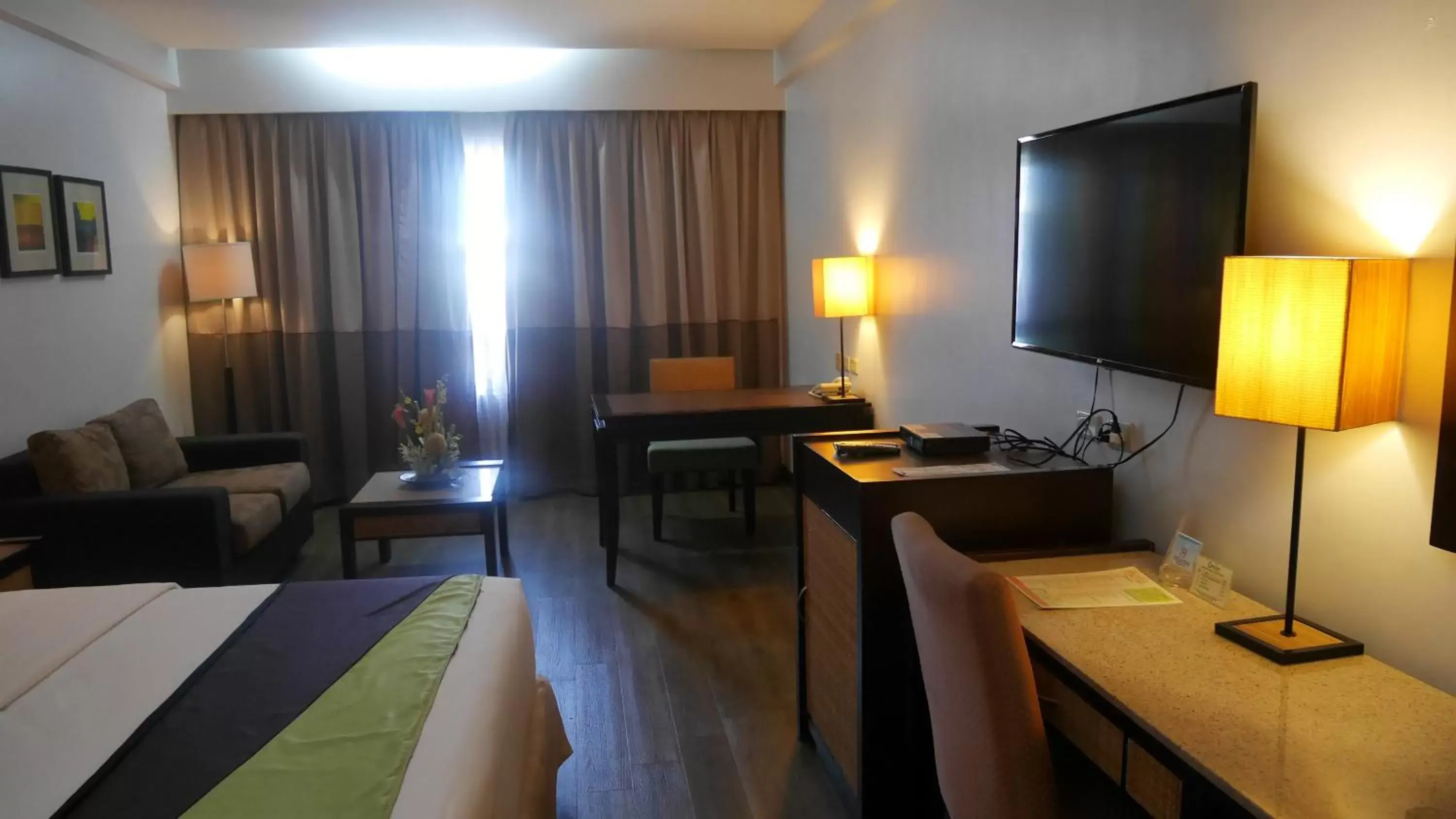Photo of the whole room, TV/Entertainment Center in Circle Inn Hotel and Suites Bacolod