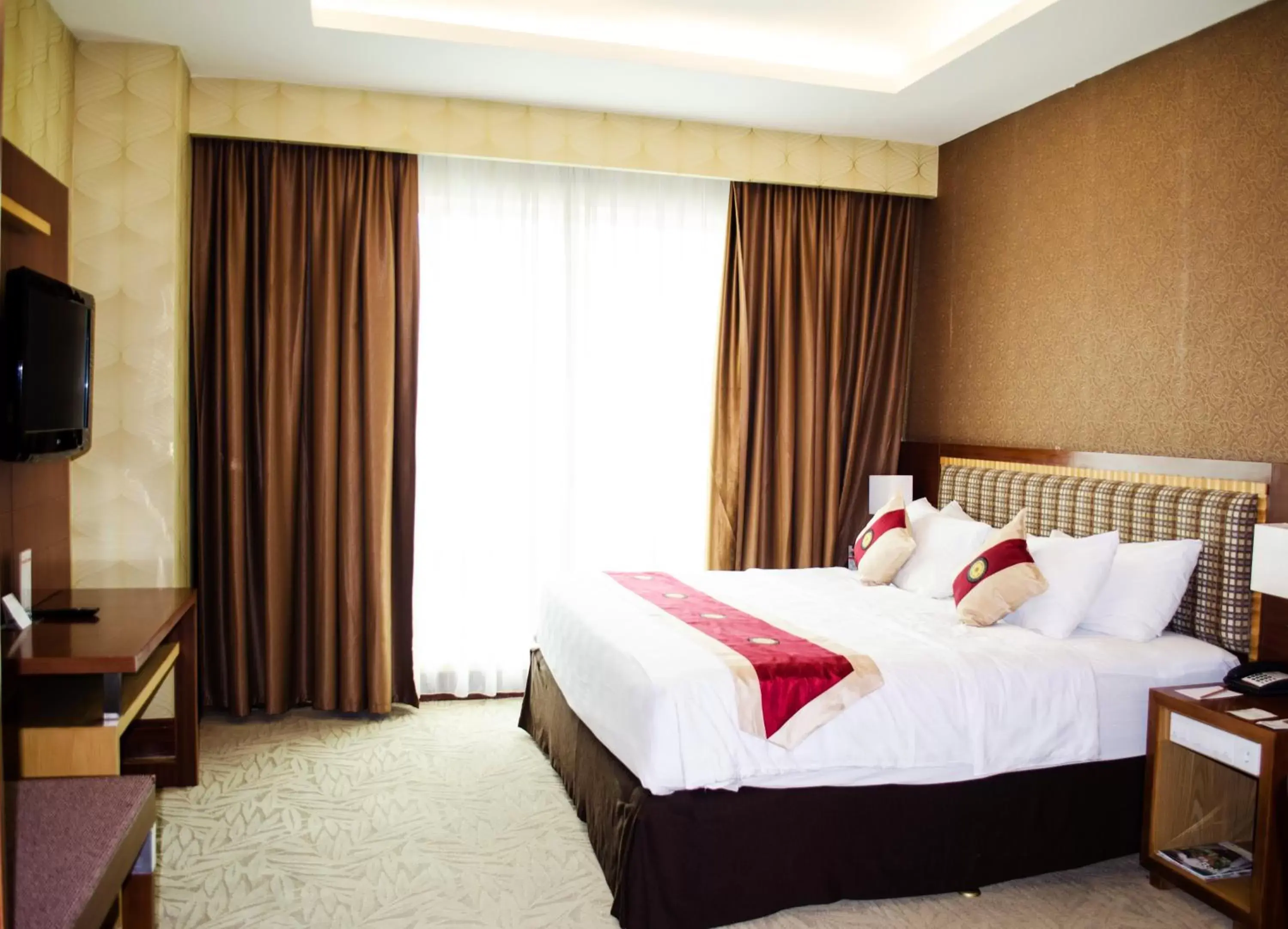 Bed in Swiss-Belhotel Maleosan Manado