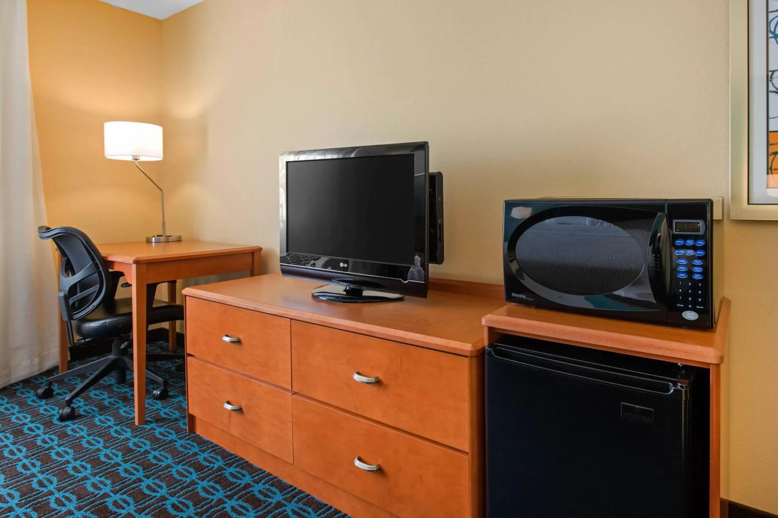 Photo of the whole room, TV/Entertainment Center in Fairfield Inn & Suites St. Cloud