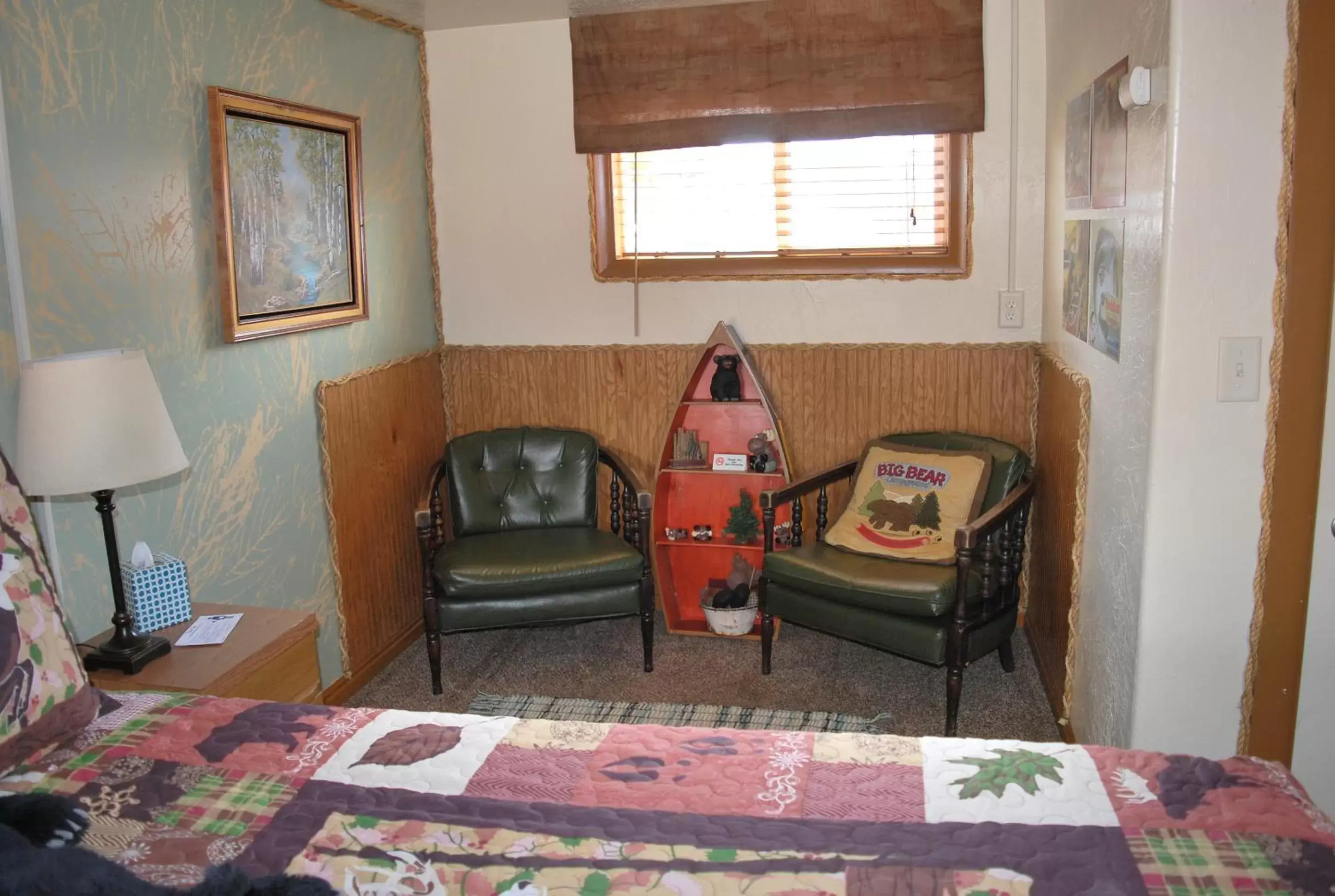 Bedroom, Seating Area in Cowboy Country Inn