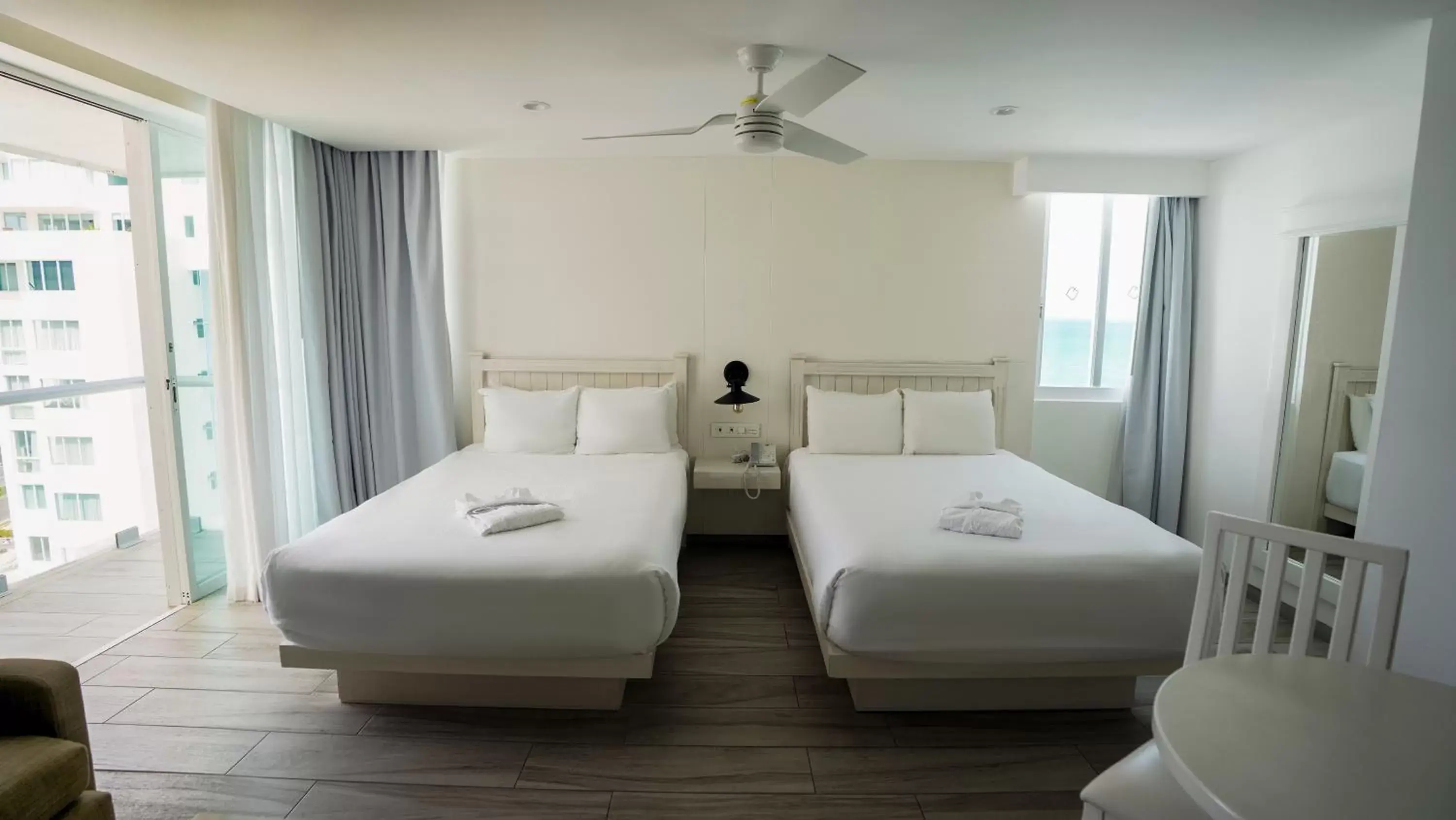 Bed in Oleo Cancun Playa Boutique All Inclusive Resort