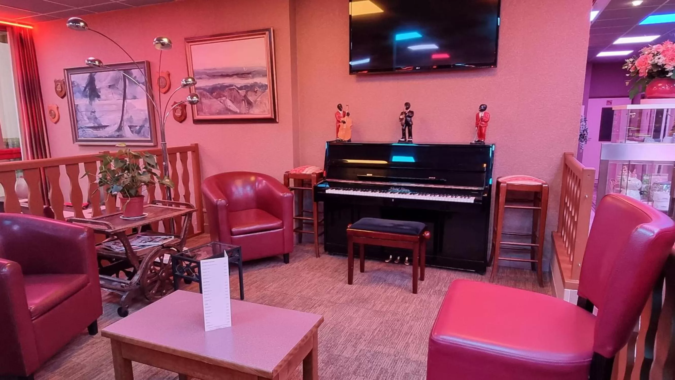 Communal lounge/ TV room in Hôtel Siatel Besançon Chateaufarine