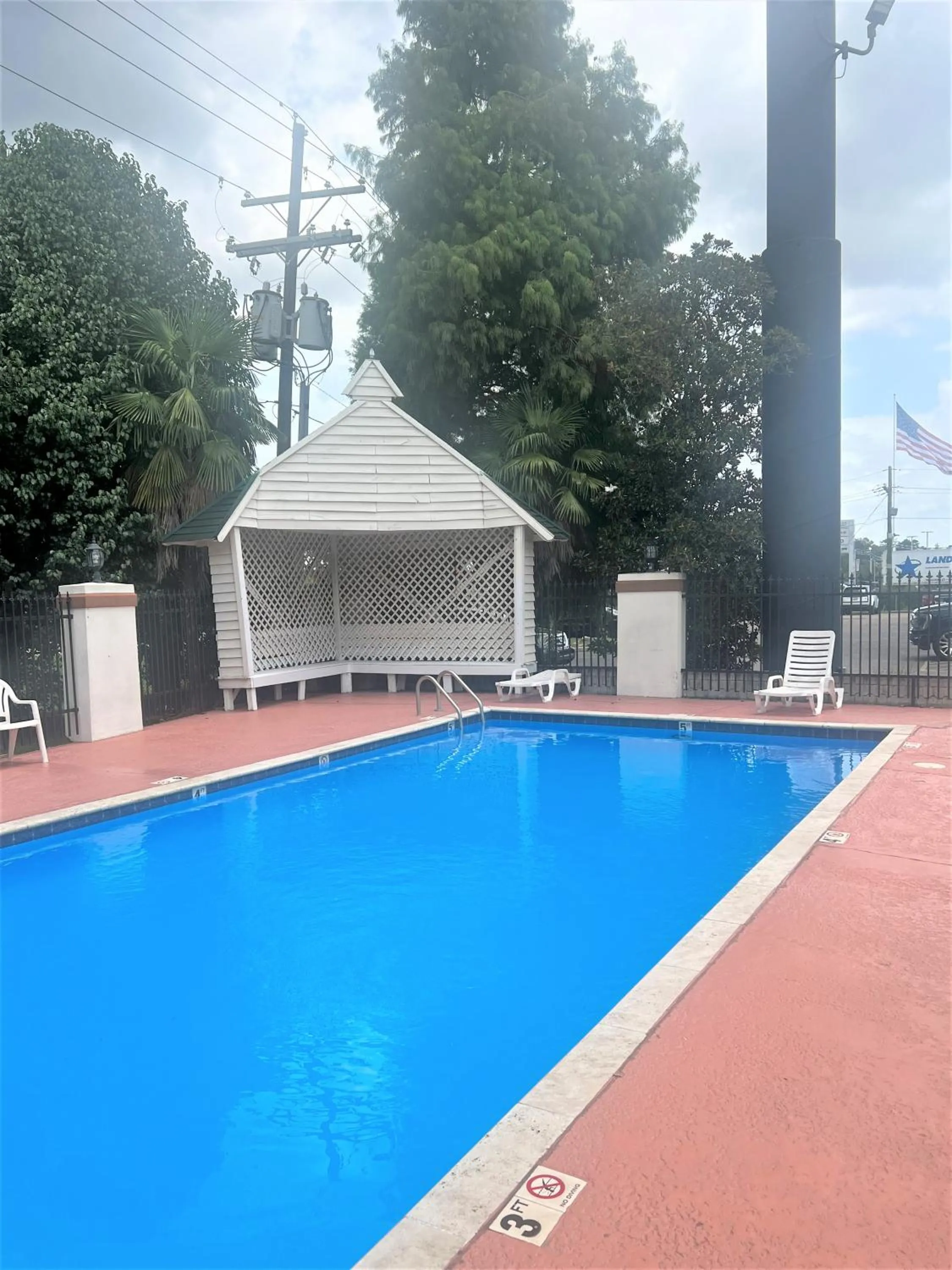 Swimming pool in Days Inn by Wyndham Denham Springs-Baton Rouge East