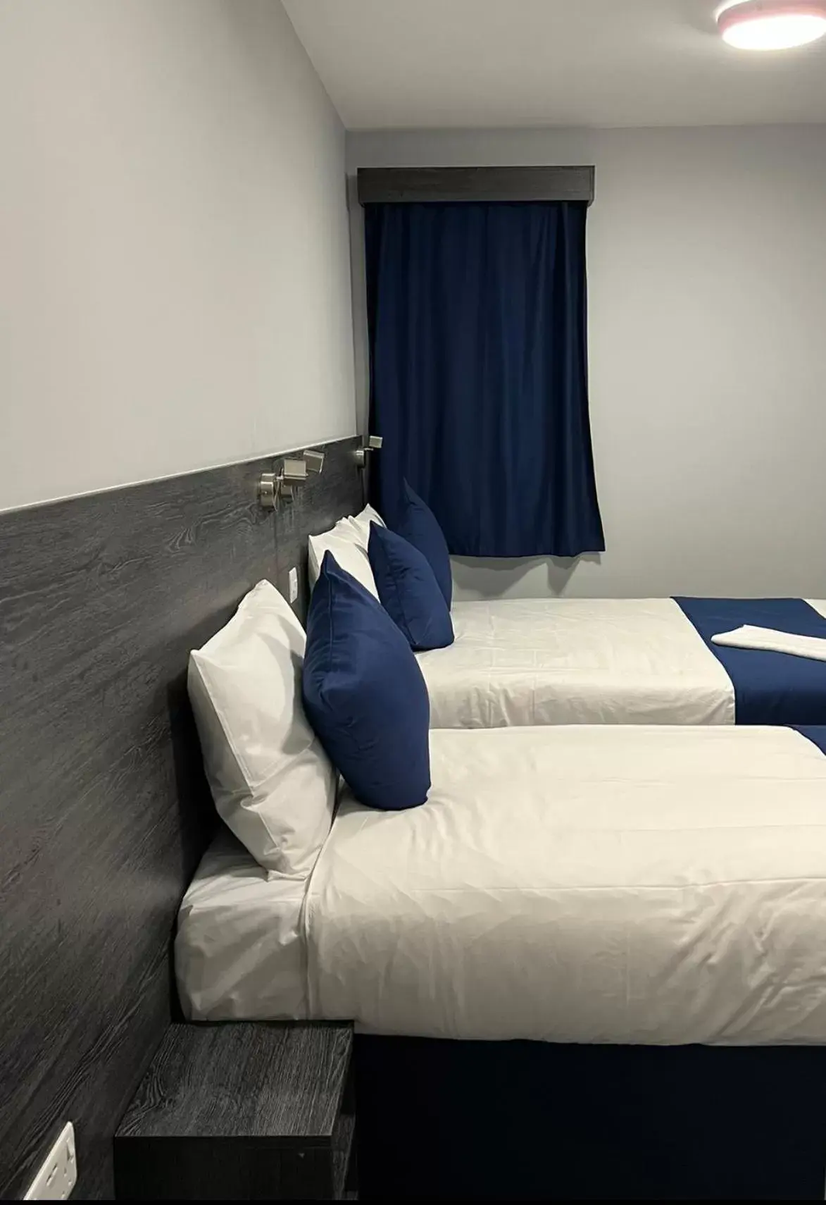 Bed in Blue Sapphire Hotel