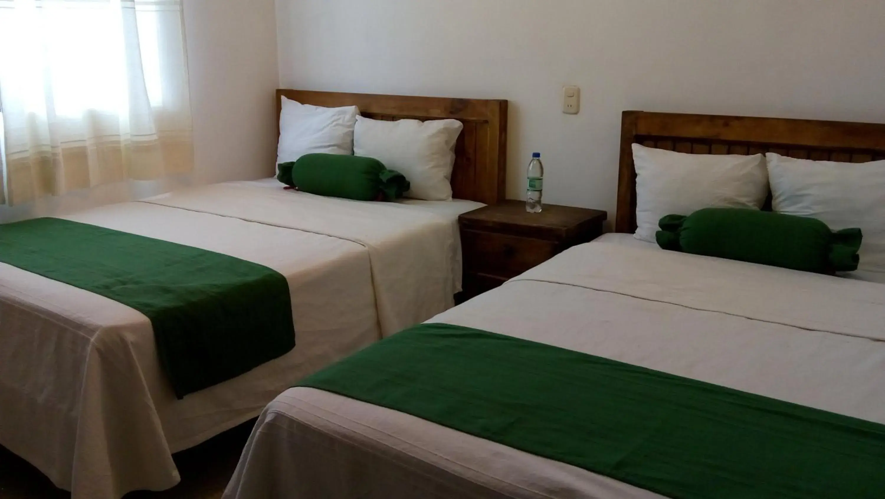 Bed in Villas del Sol Hotel & Bungalows