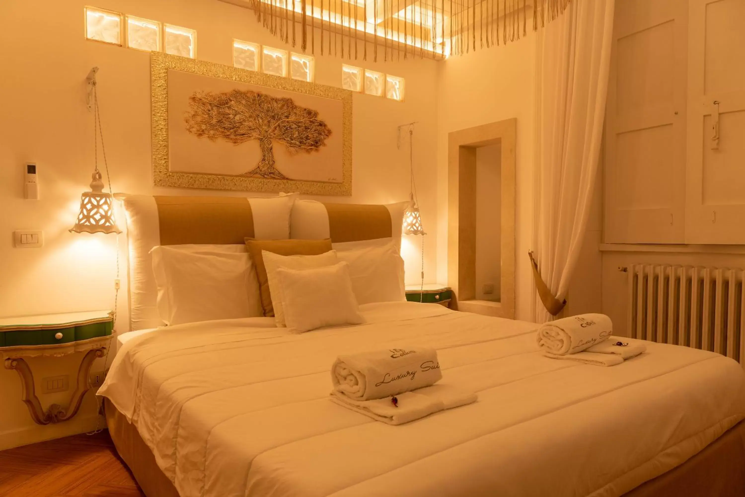 Bed in Cadelli Luxury Suite & Apartments