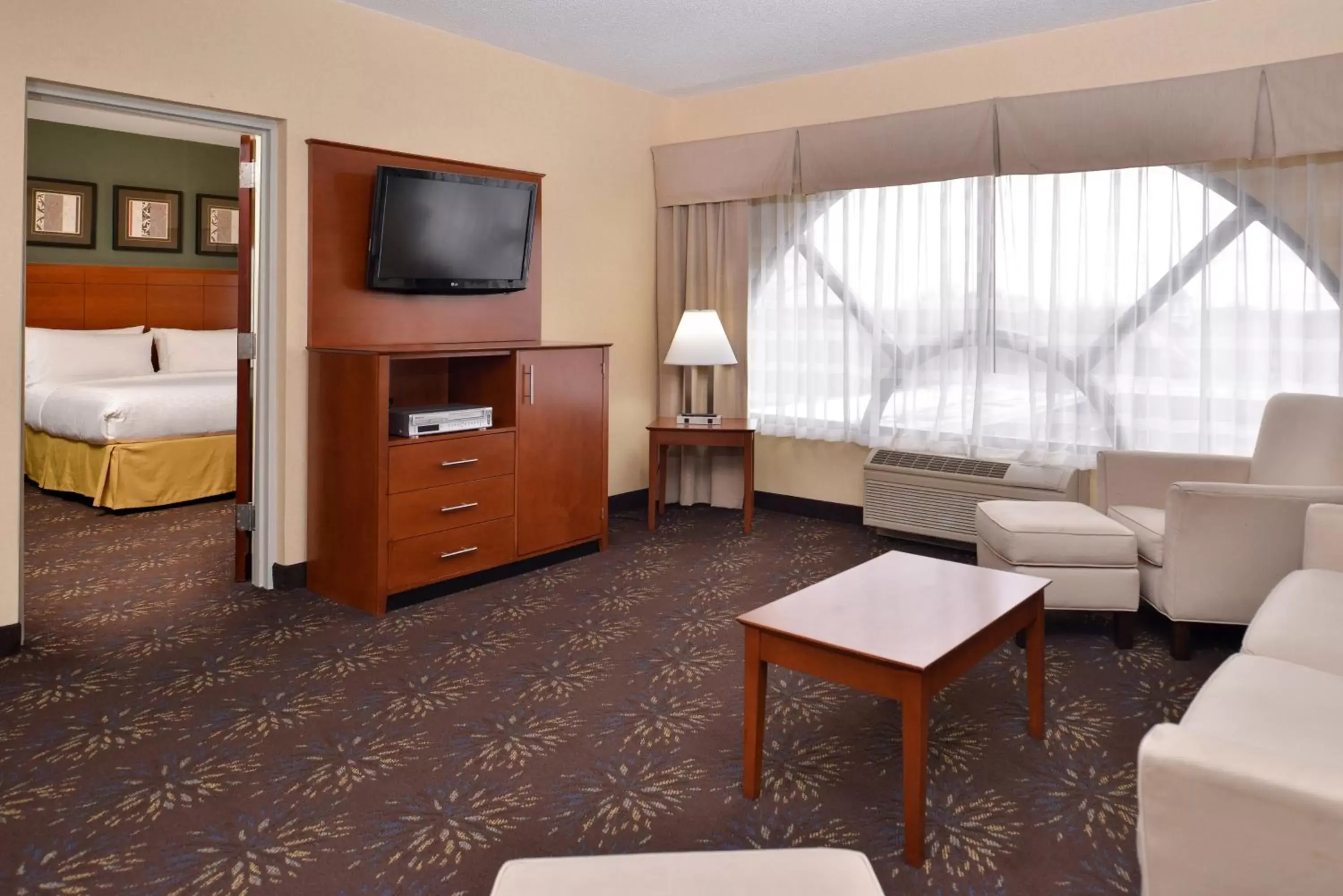 Photo of the whole room, TV/Entertainment Center in Holiday Inn Express Hotel & Suites West Chester, an IHG Hotel