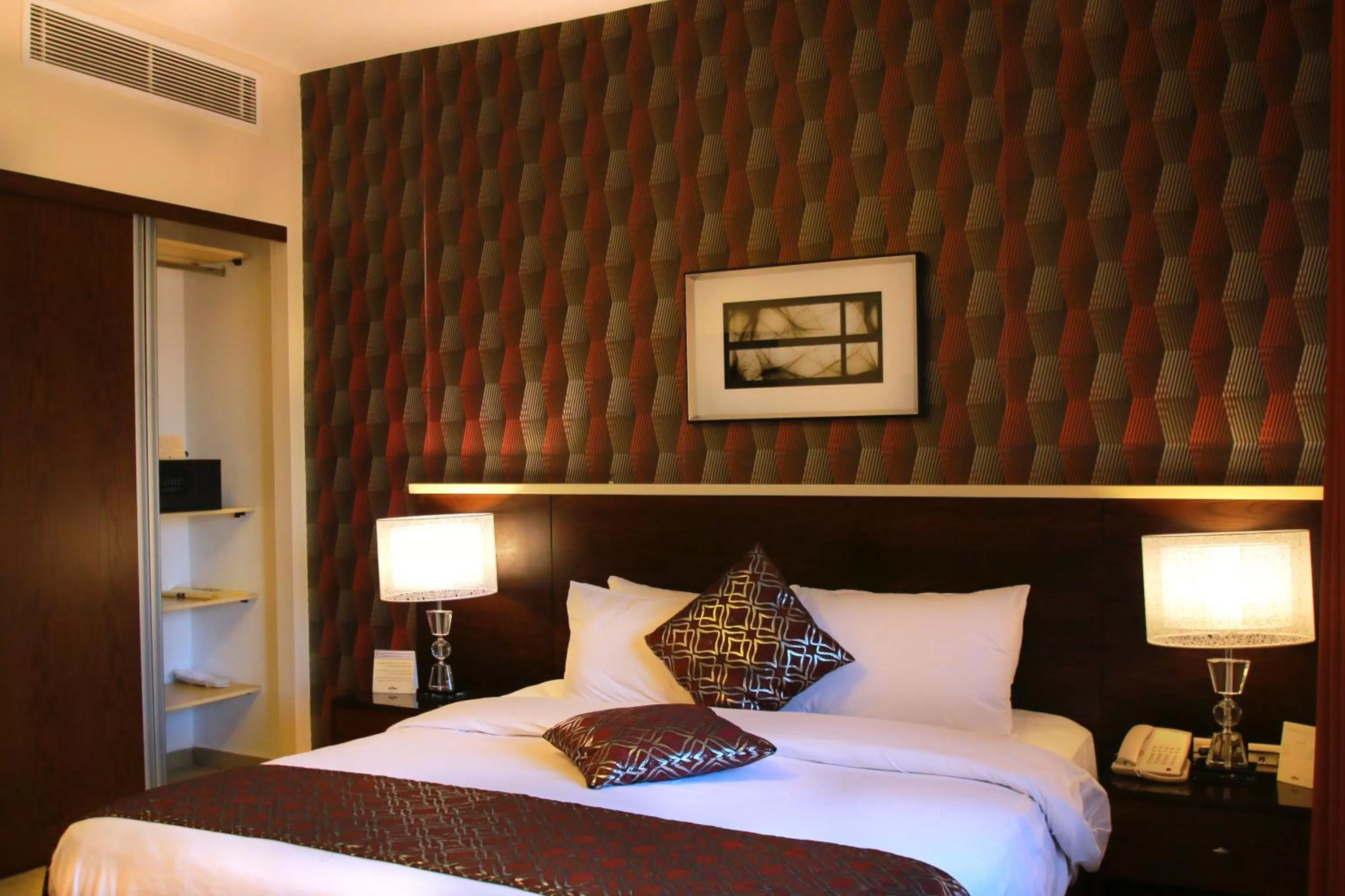 Bed in City Rose Hotel Suites