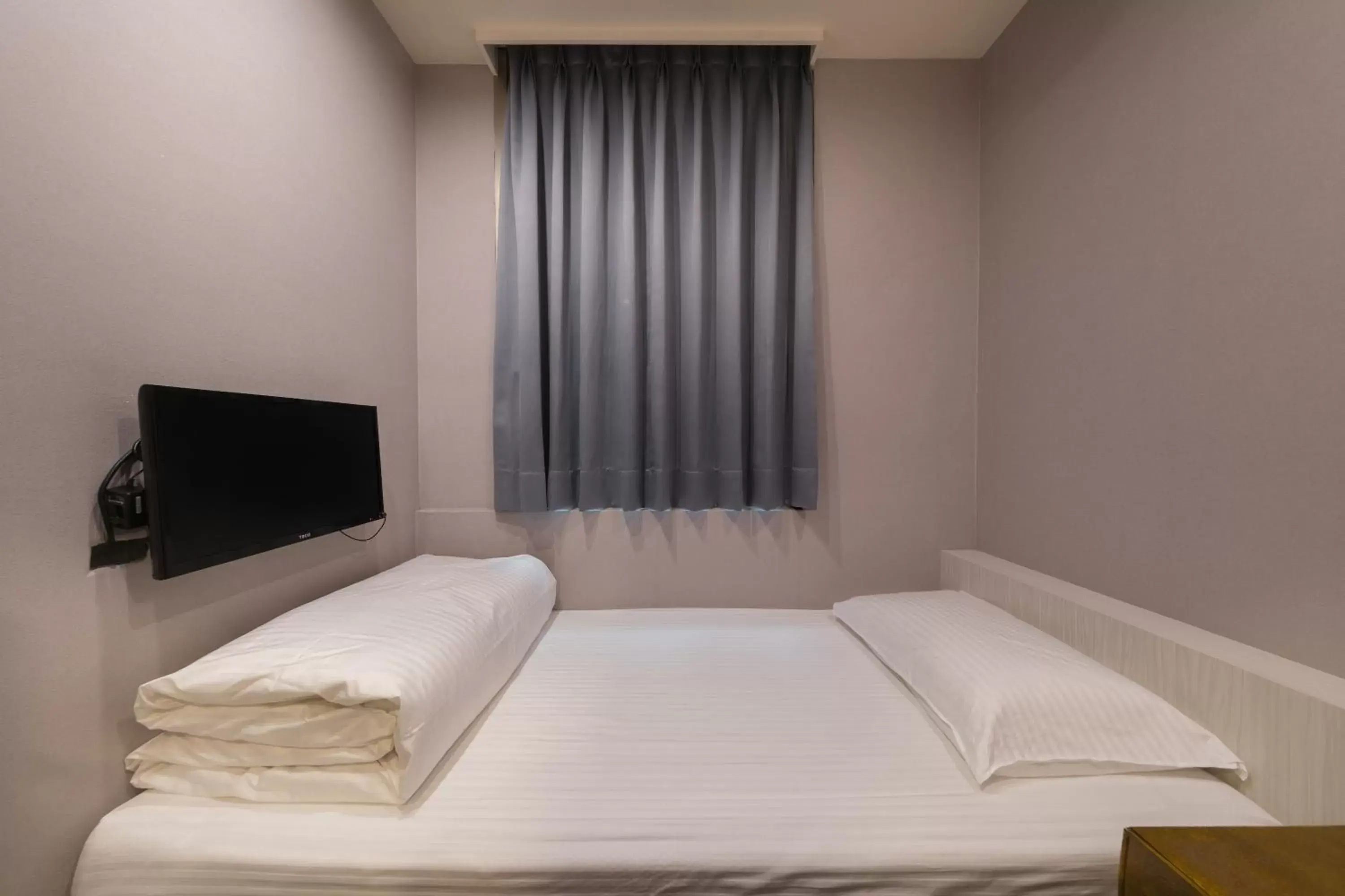 Bed in Skyone Hotel