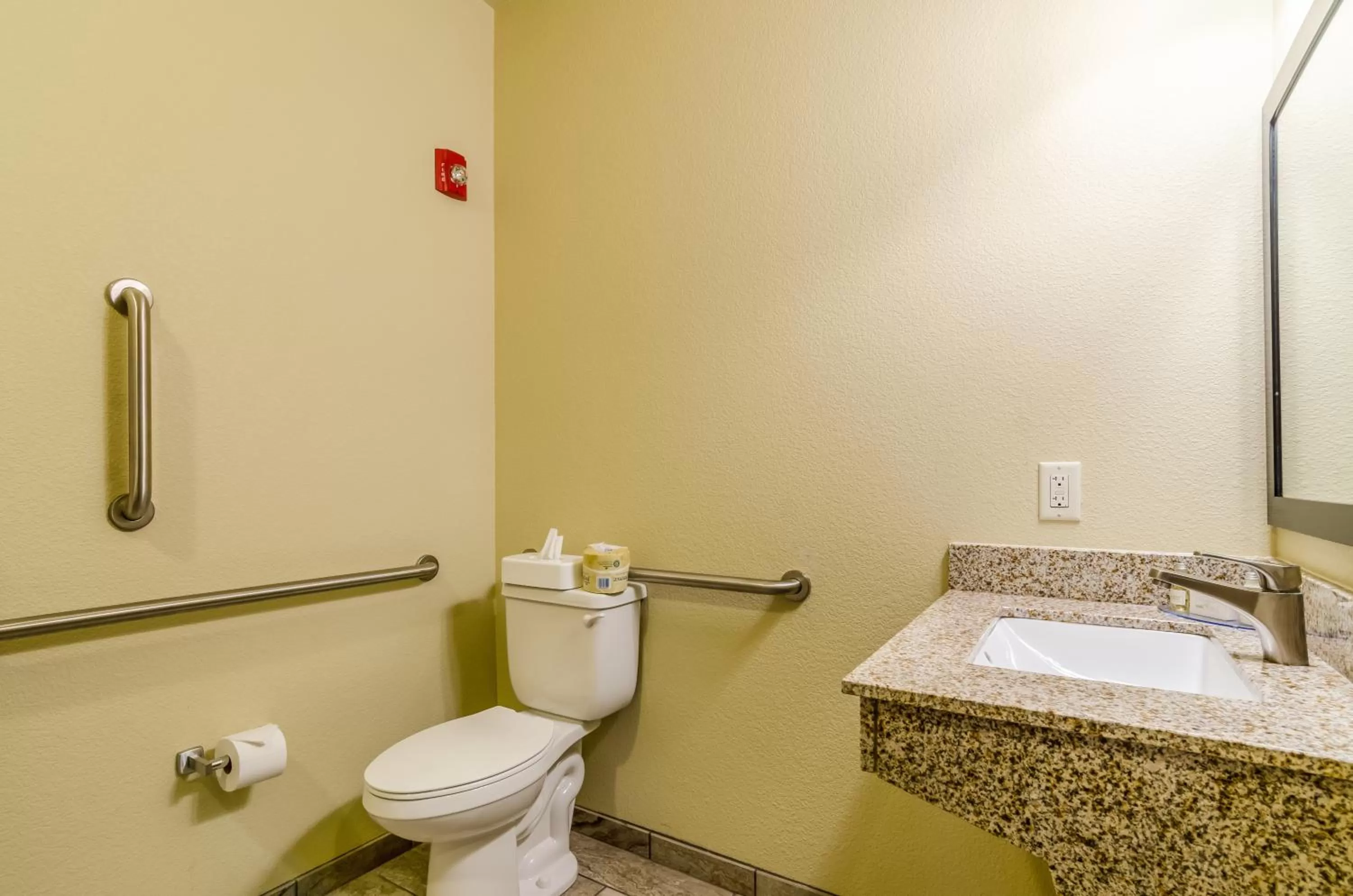 Toilet in Cobblestone Hotel & Suites - McCook