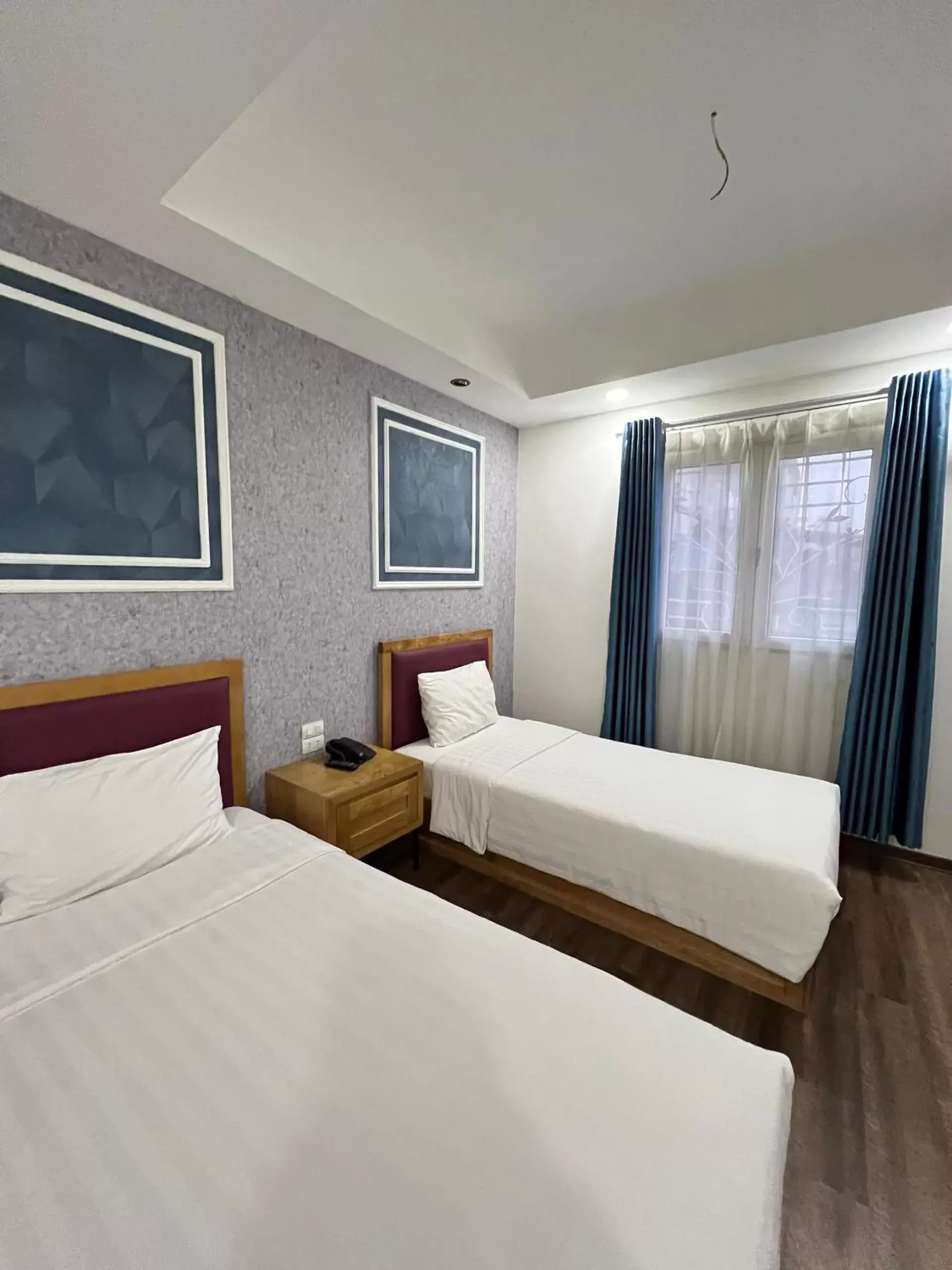 Bed in Holiday Suites Hotel & Spa