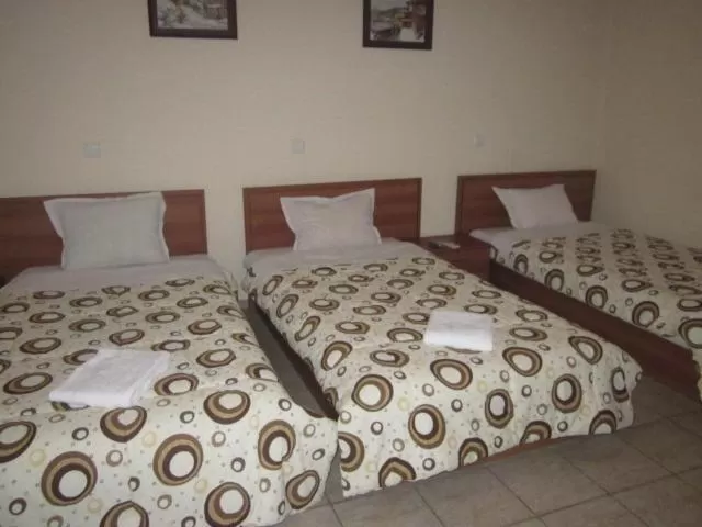 Bed in Versai Hotel