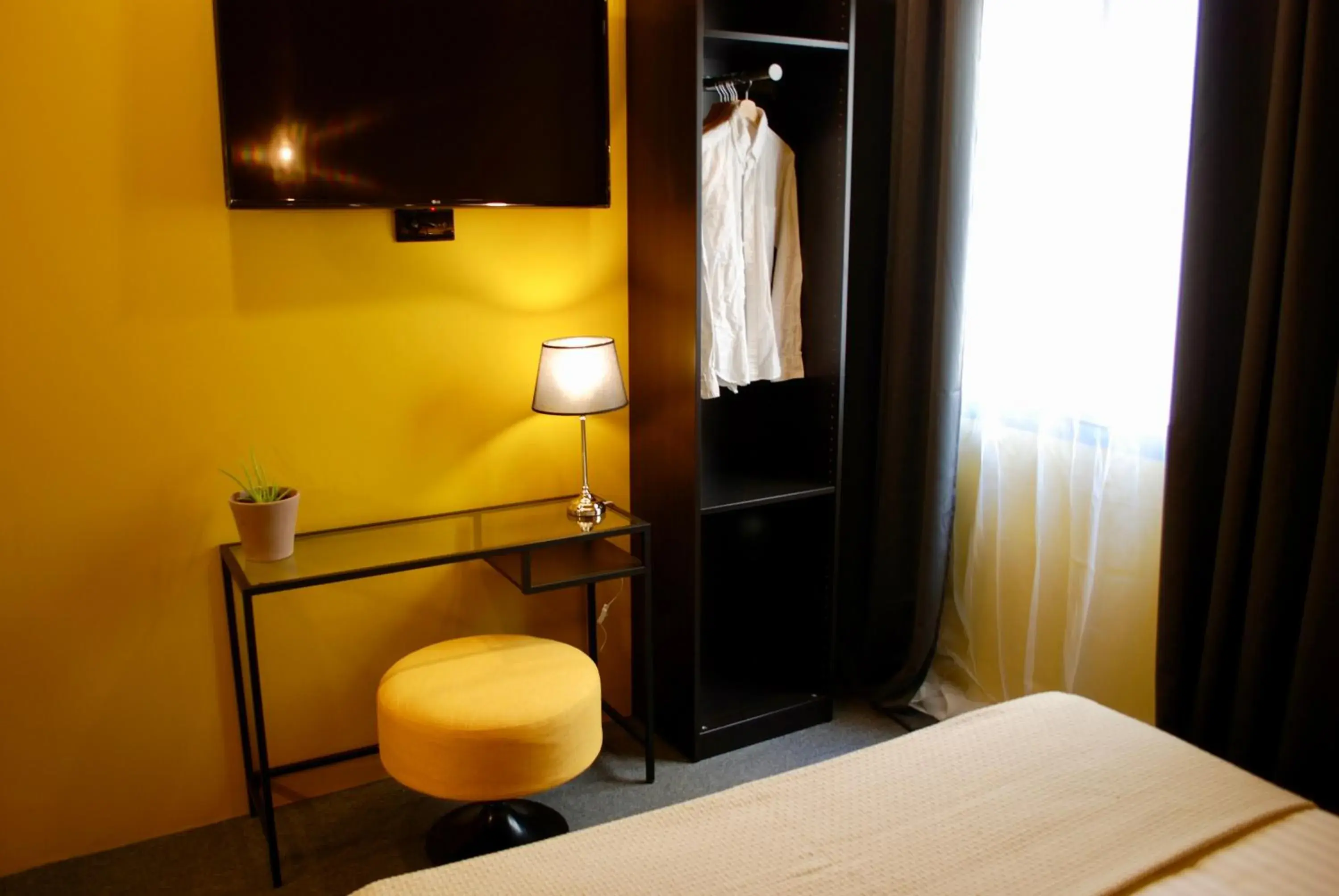 Bed, TV/Entertainment Center in HoGraFic hotel boutique