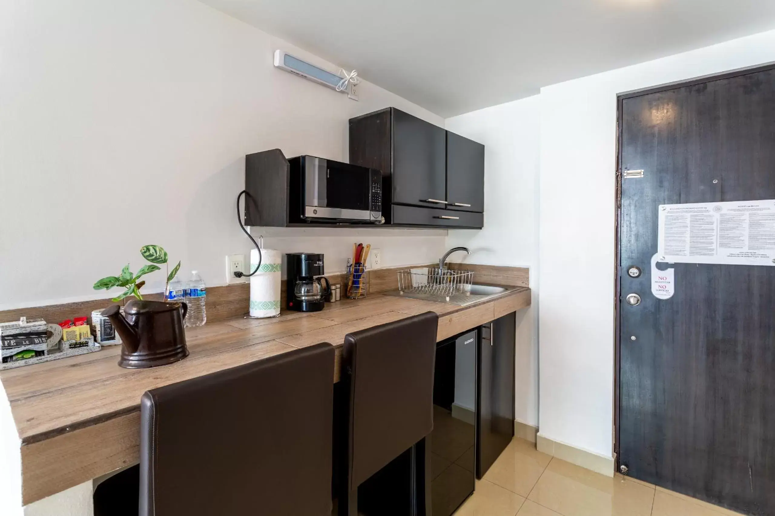 Kitchen/Kitchenette in Suites 259 Condesa