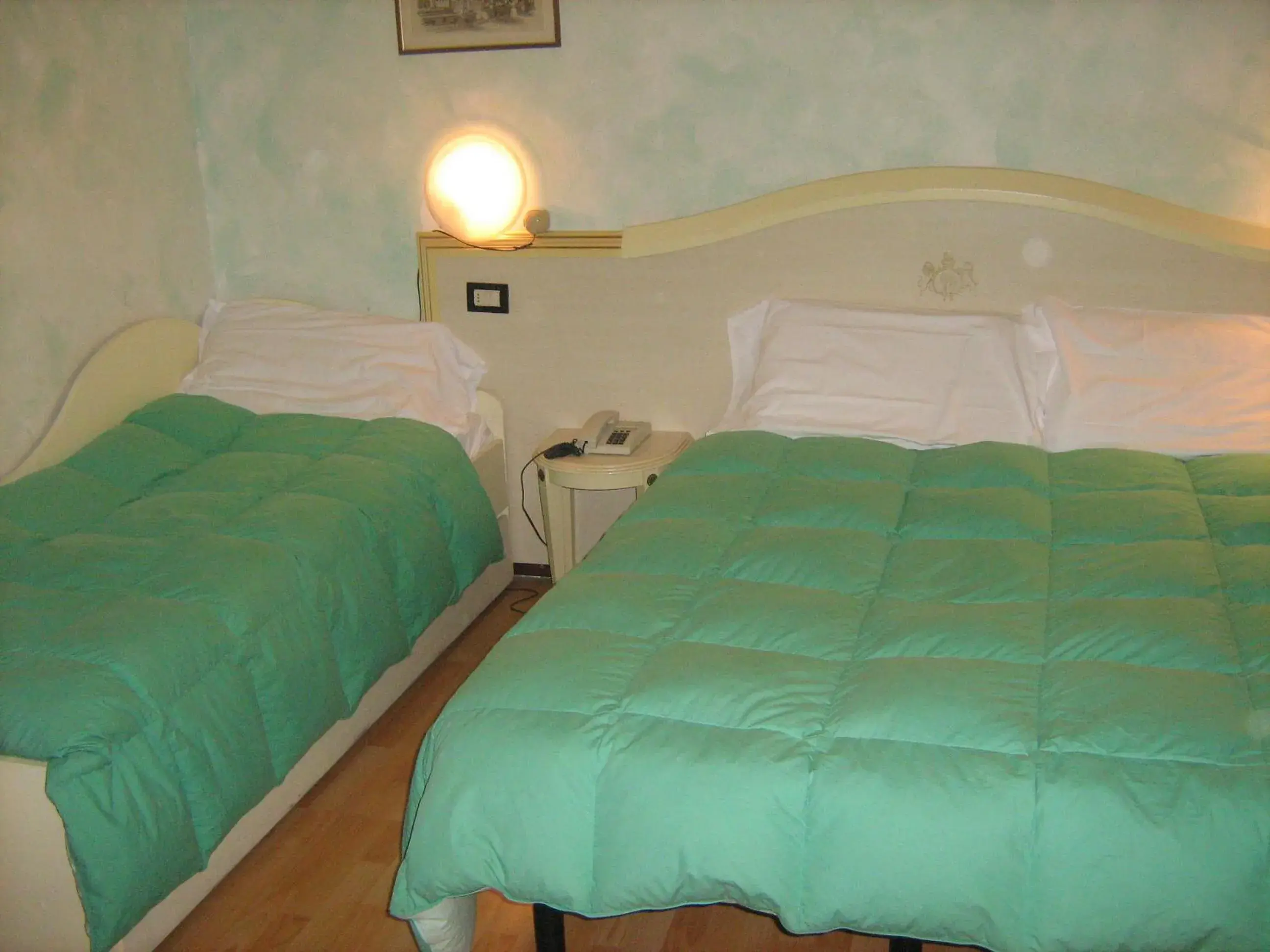 Bed in Hotel San Marino