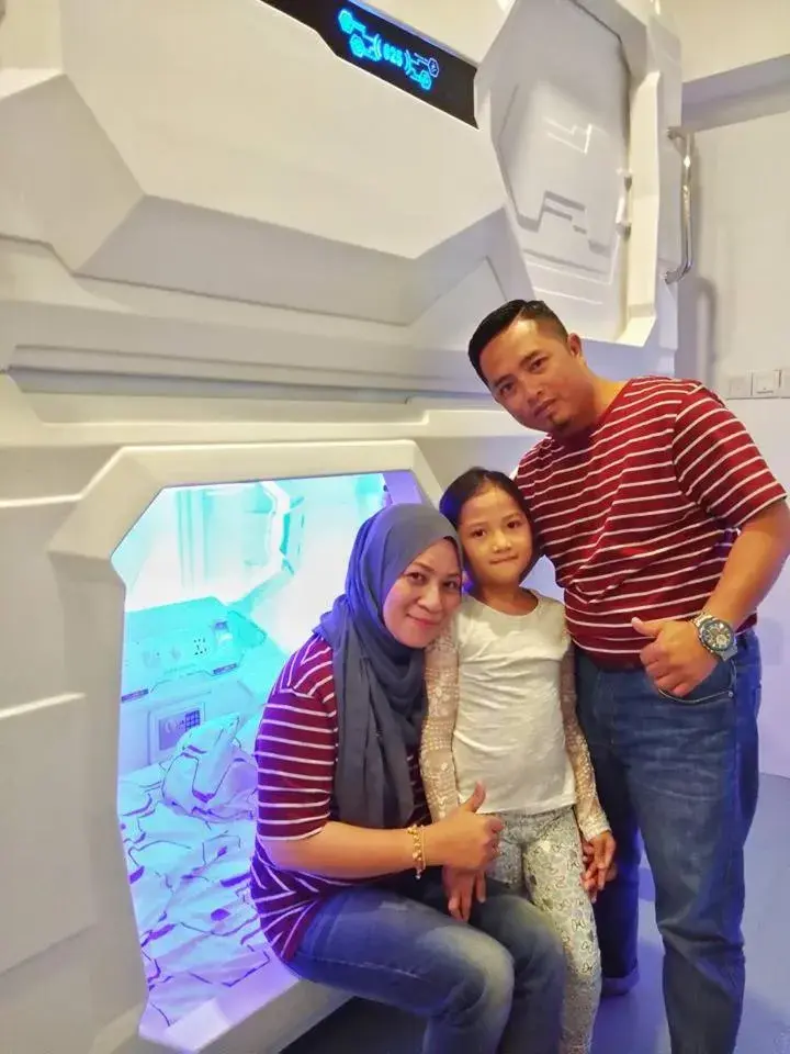 Family in Space Cap Hotel