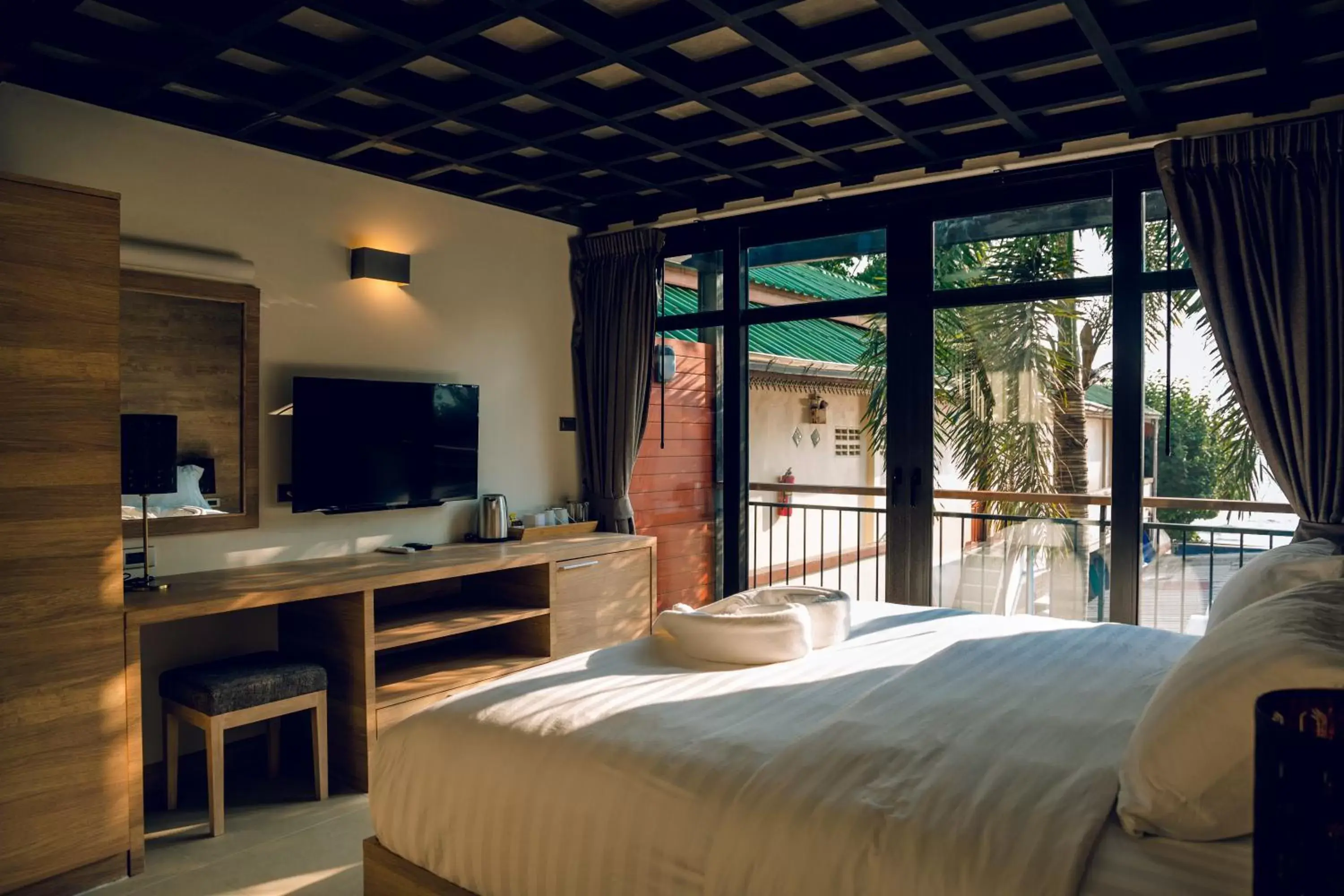 Photo of the whole room, TV/Entertainment Center in 15 Palms Beach Resort