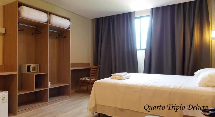 Bed in Minas Platinum Hotel & Convention