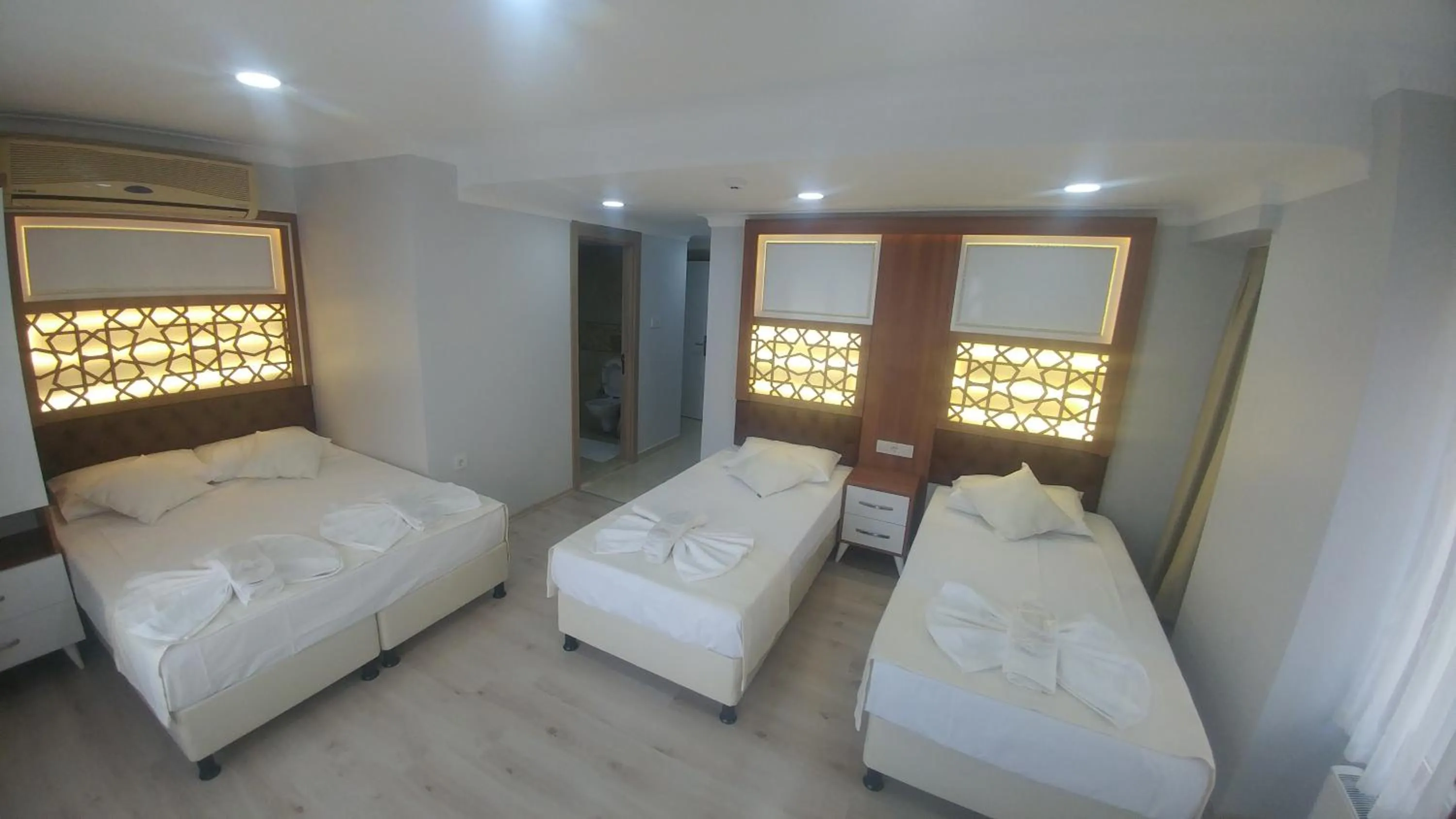 Bed in Grand Liza Hotel