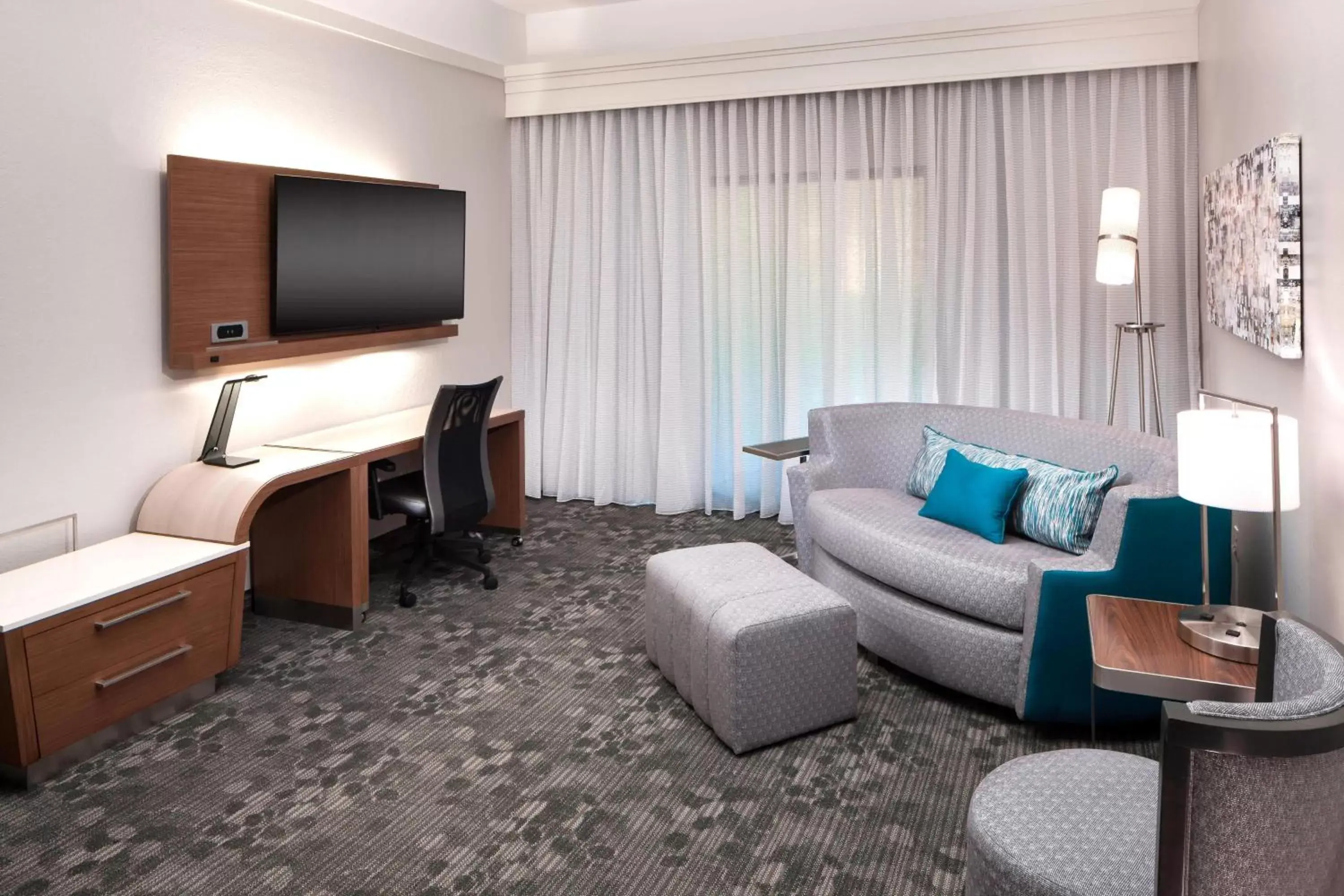 Photo of the whole room, Seating Area in Courtyard by Marriott Pensacola