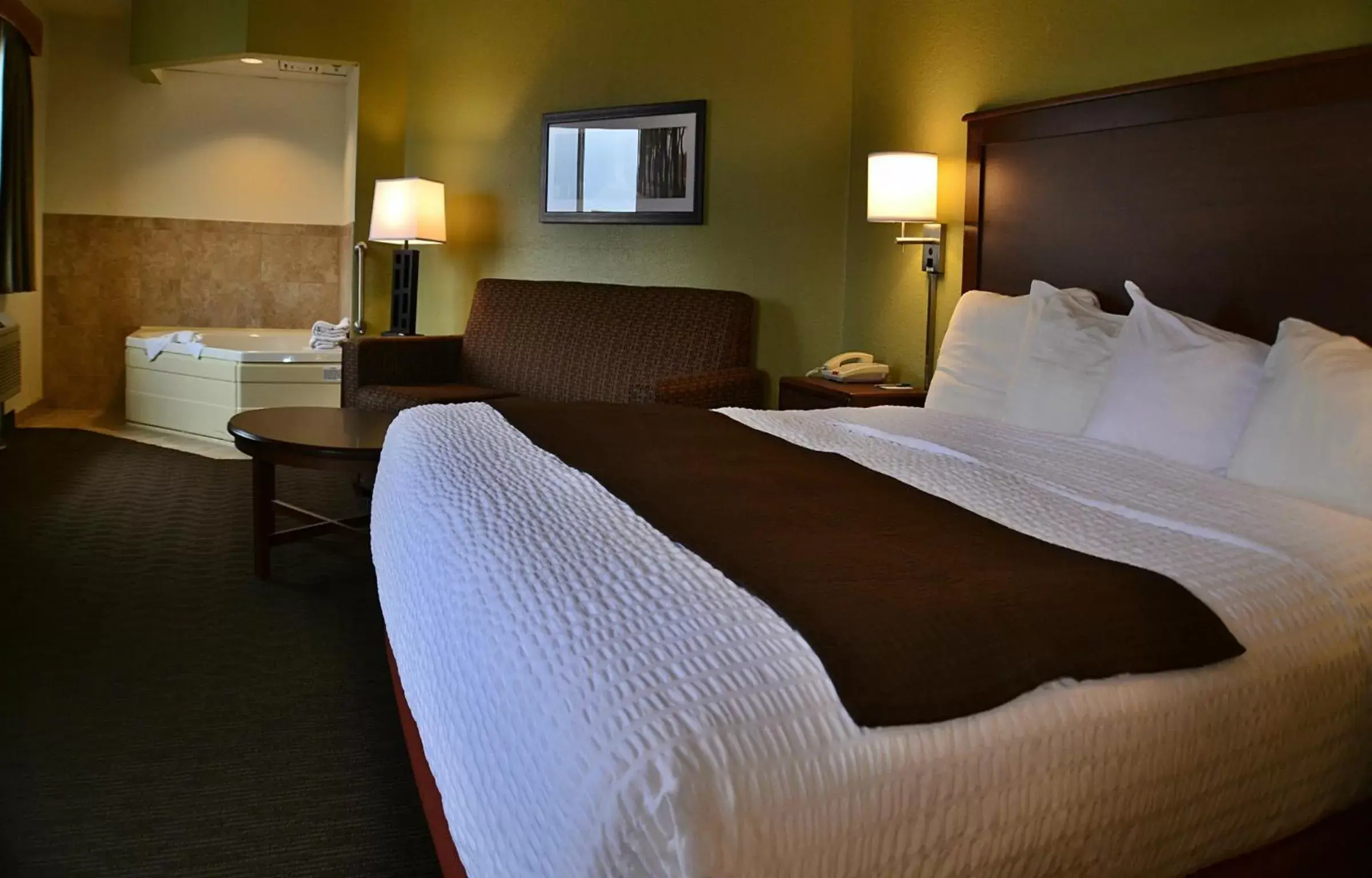 Bed in AmericInn by Wyndham Calumet