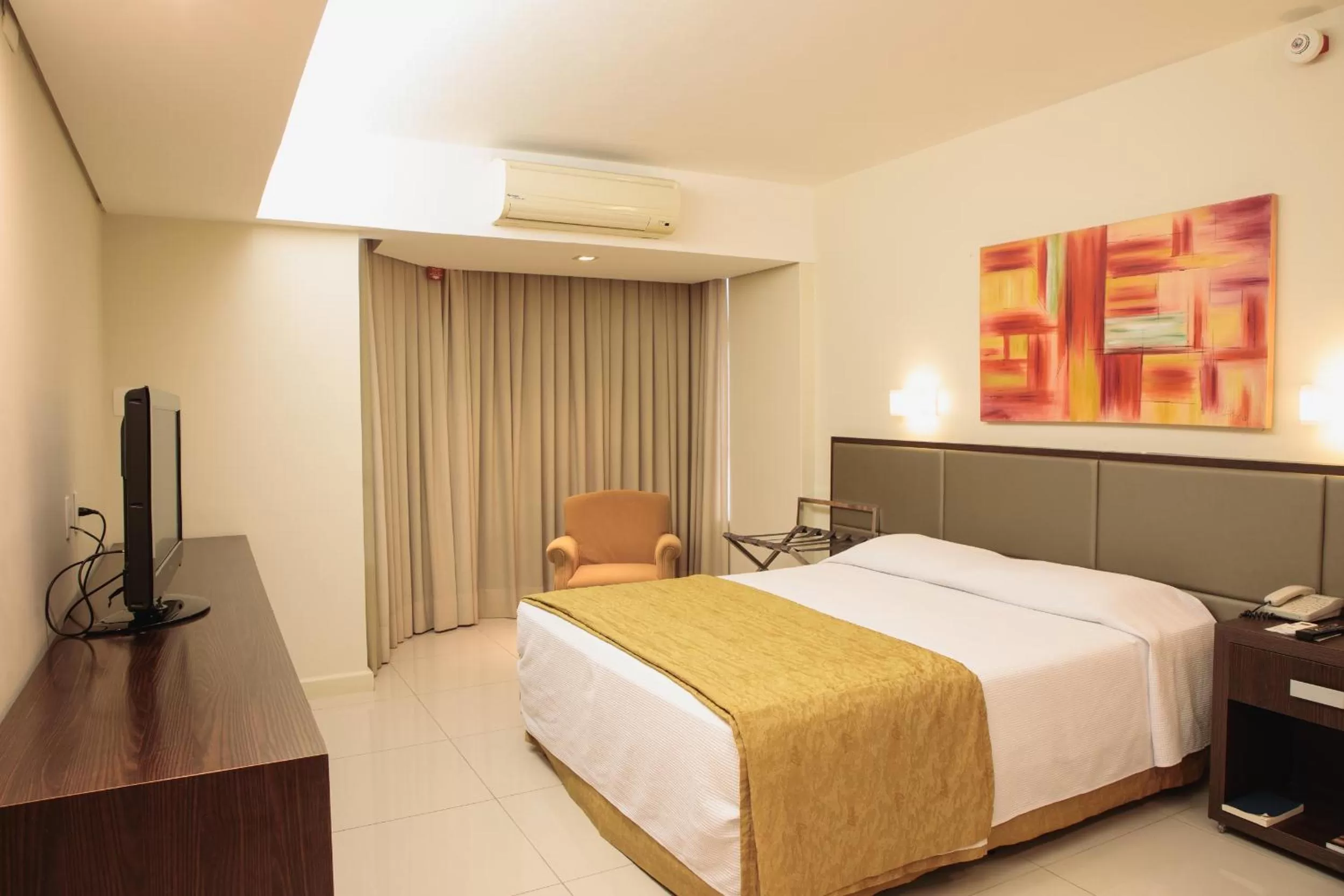 Bed in Rafain Palace Hotel & Convention Center