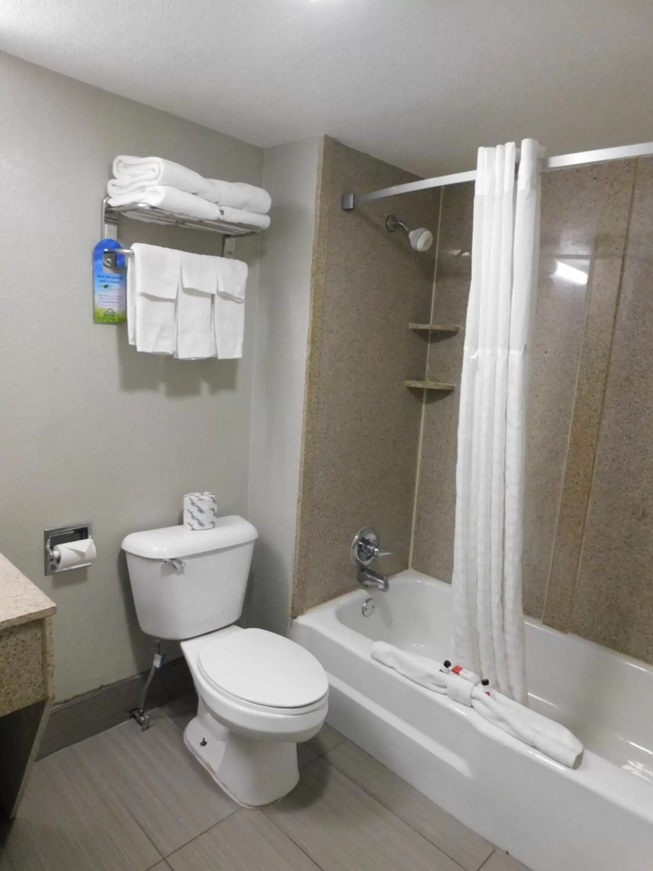 Bathroom in Days Inn & Suites by Wyndham Downtown Gatlinburg Parkway