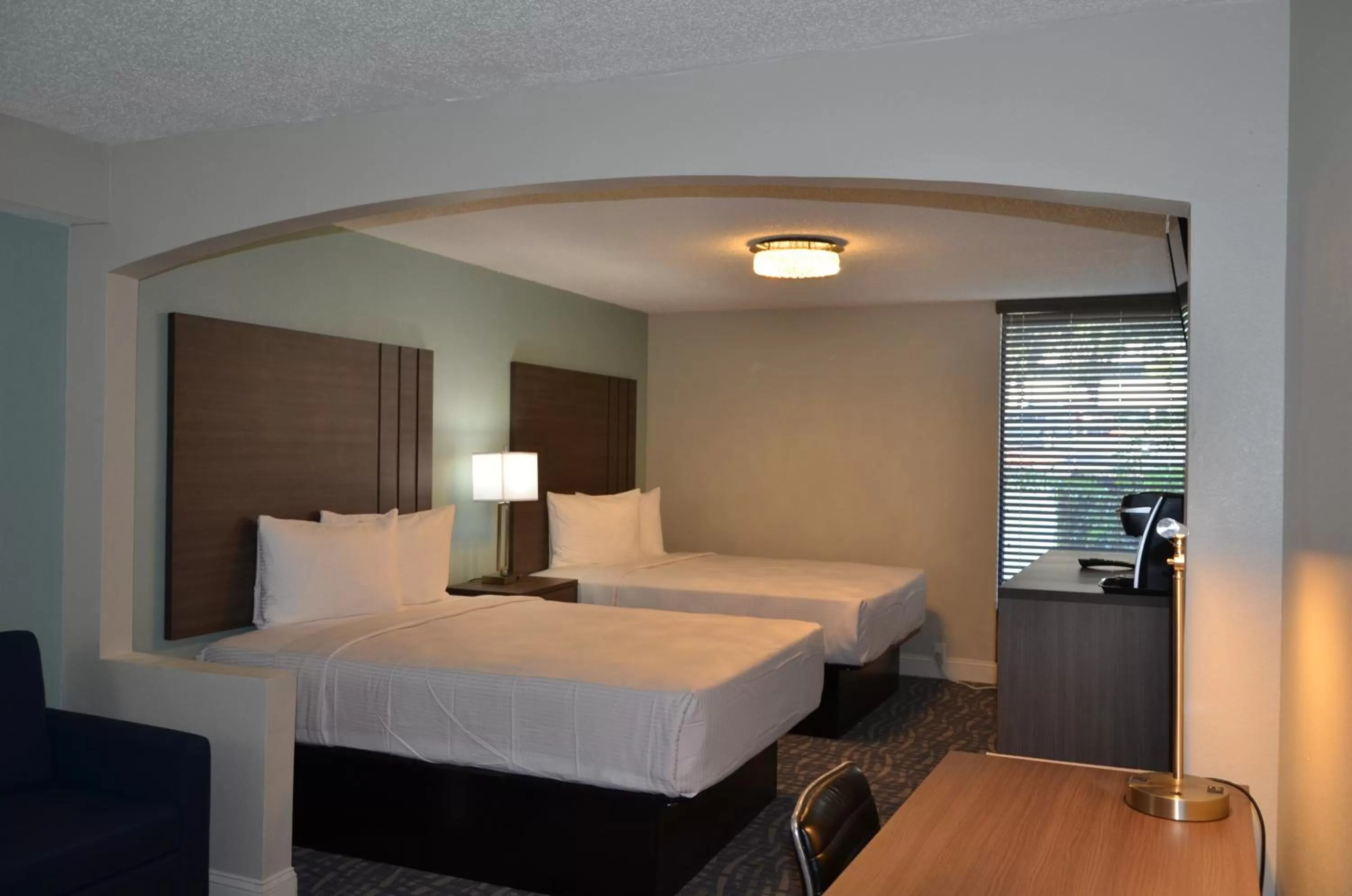 Bed in Opal Hotel & Suites