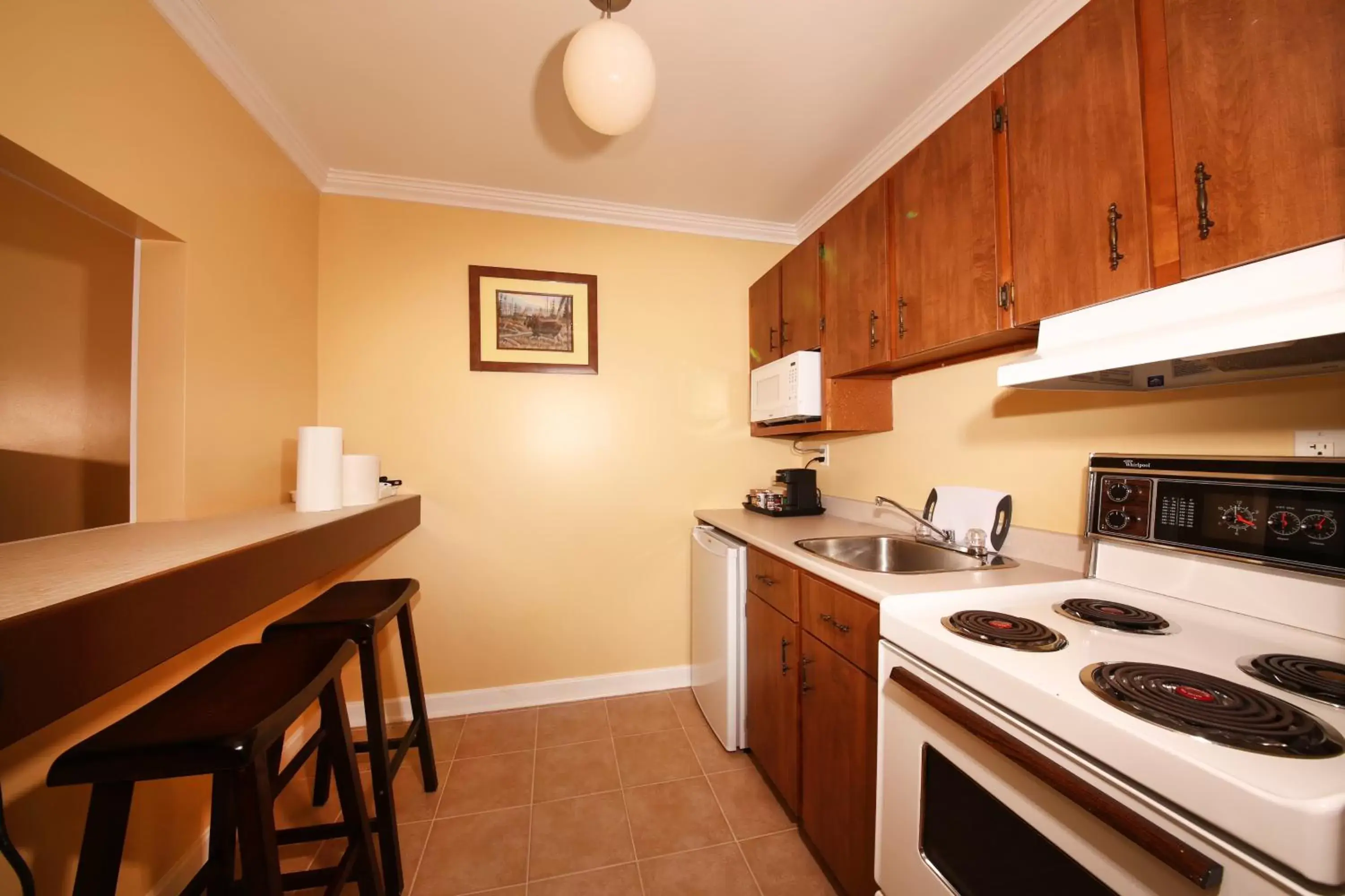 Kitchen or kitchenette in Grenfell Heritage Hotel & Suites