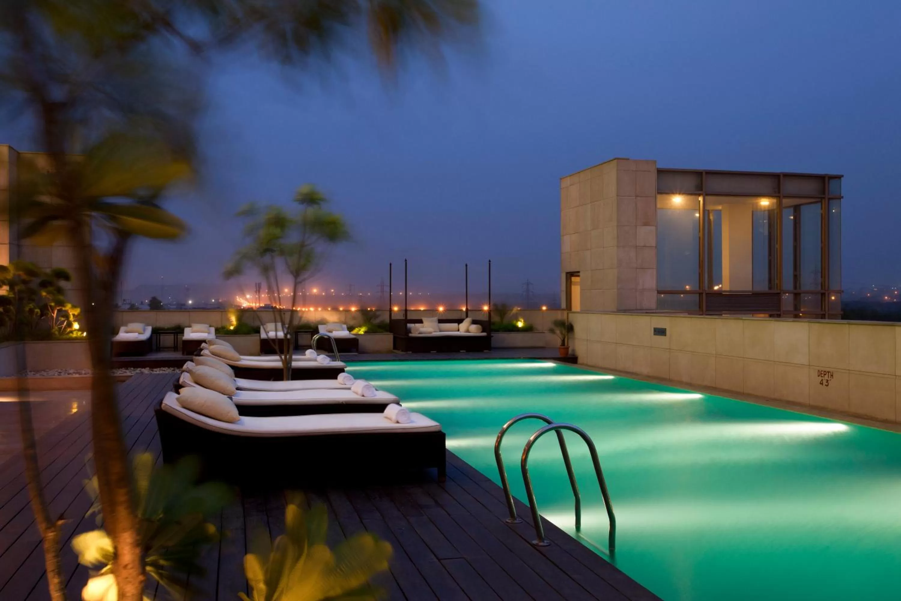 Swimming pool in Crowne Plaza New Delhi Okhla by IHG