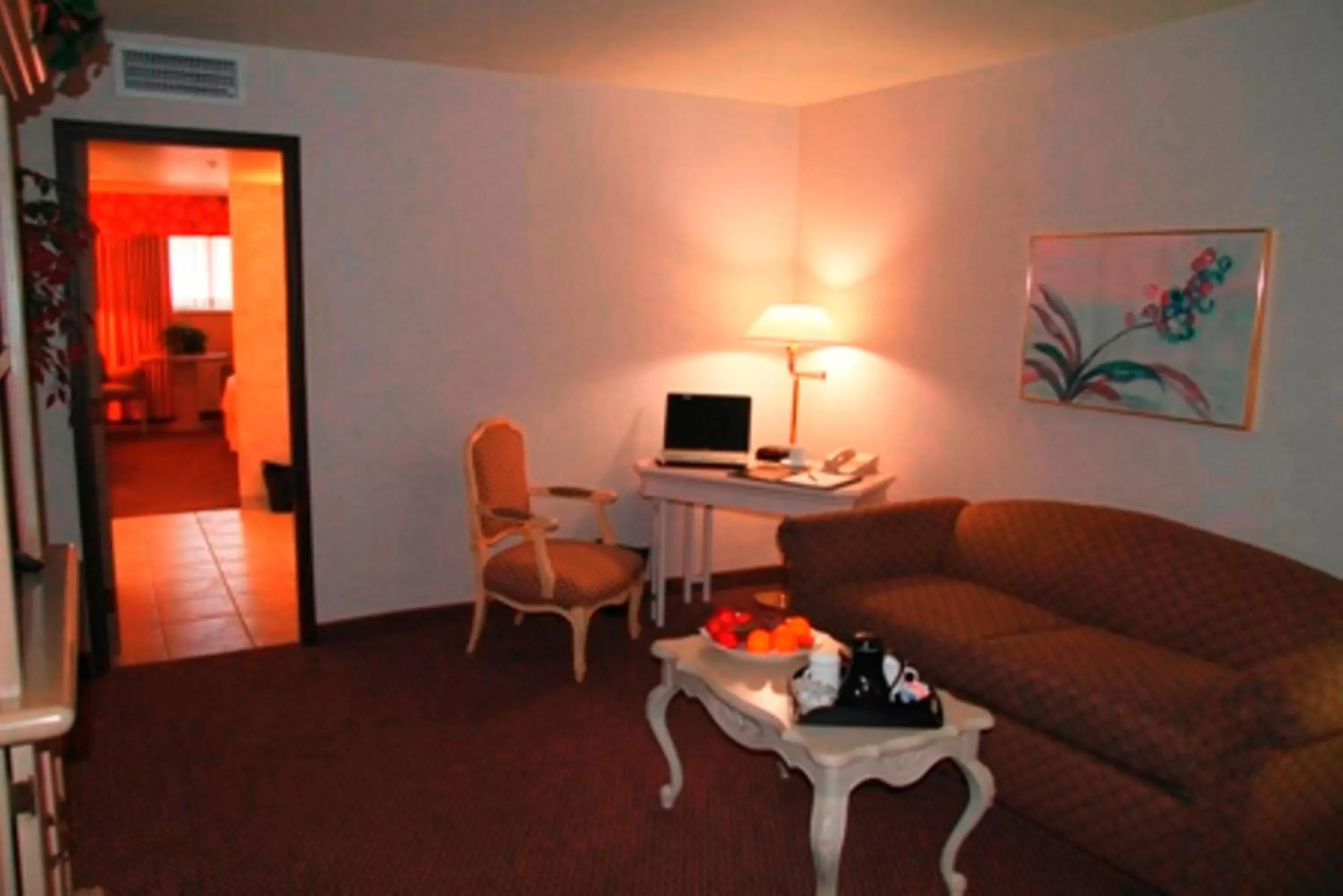 Seating Area in Ramada by Wyndham Viscount Suites Tucson East