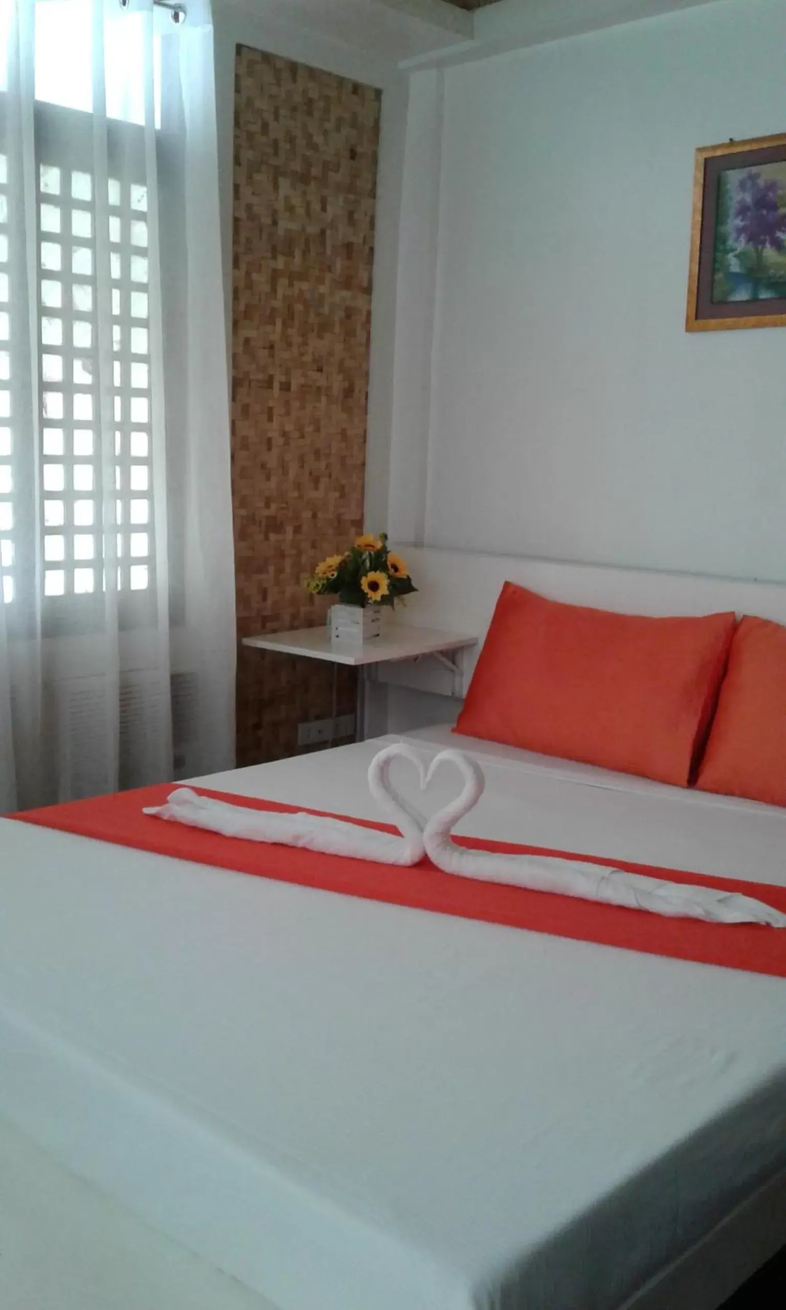 Bed in Orange Mangrove Pension House