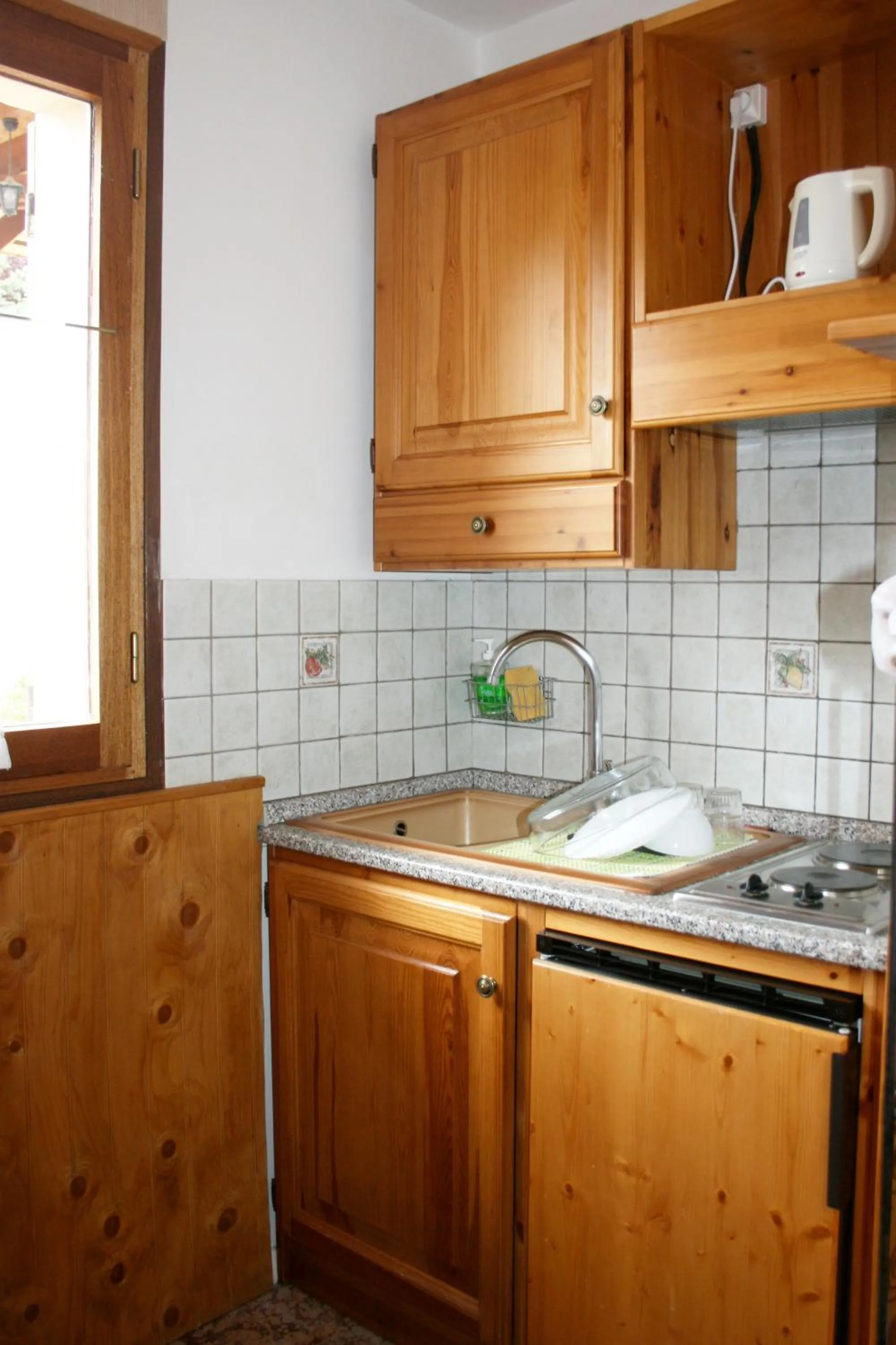 Kitchen or kitchenette in Le Catinat Fleuri