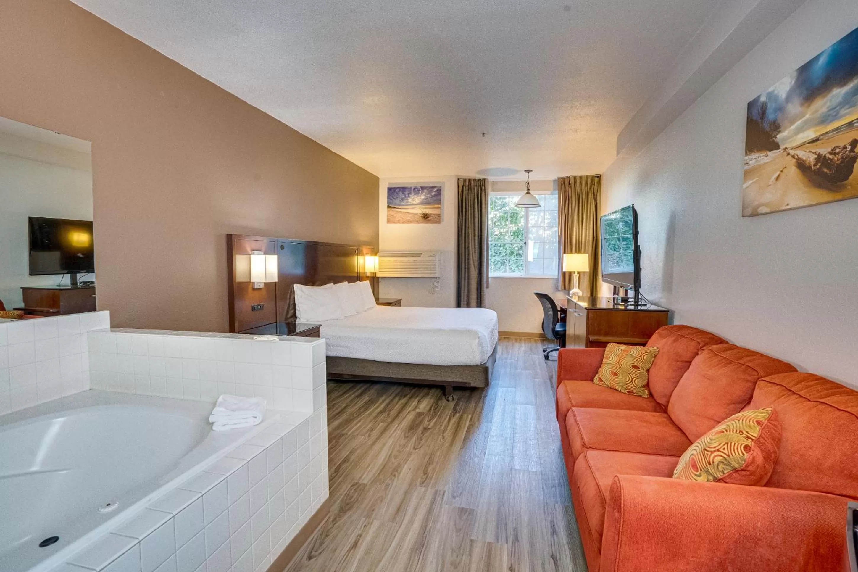 Bed in The Ashley Inn & Suites