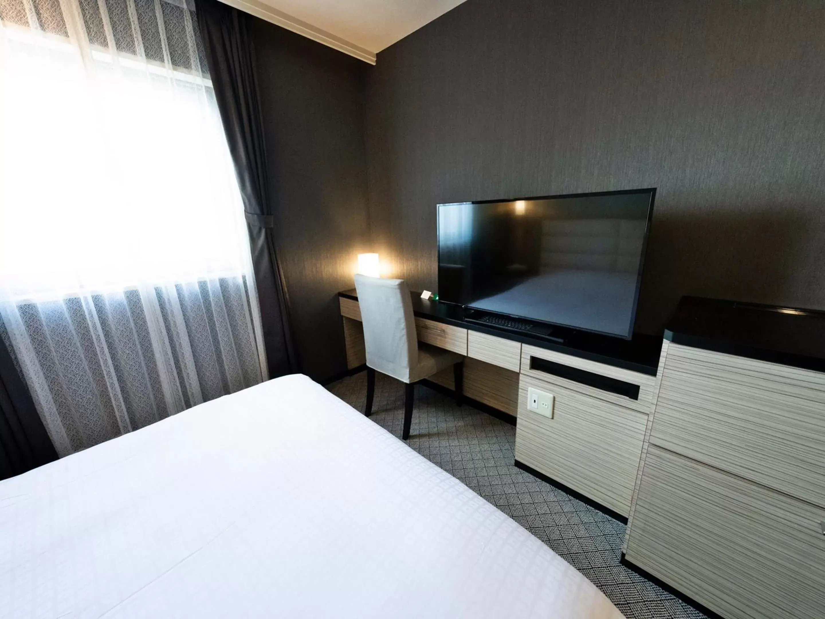 Bed, TV/Entertainment Center in ORDA HOTEL