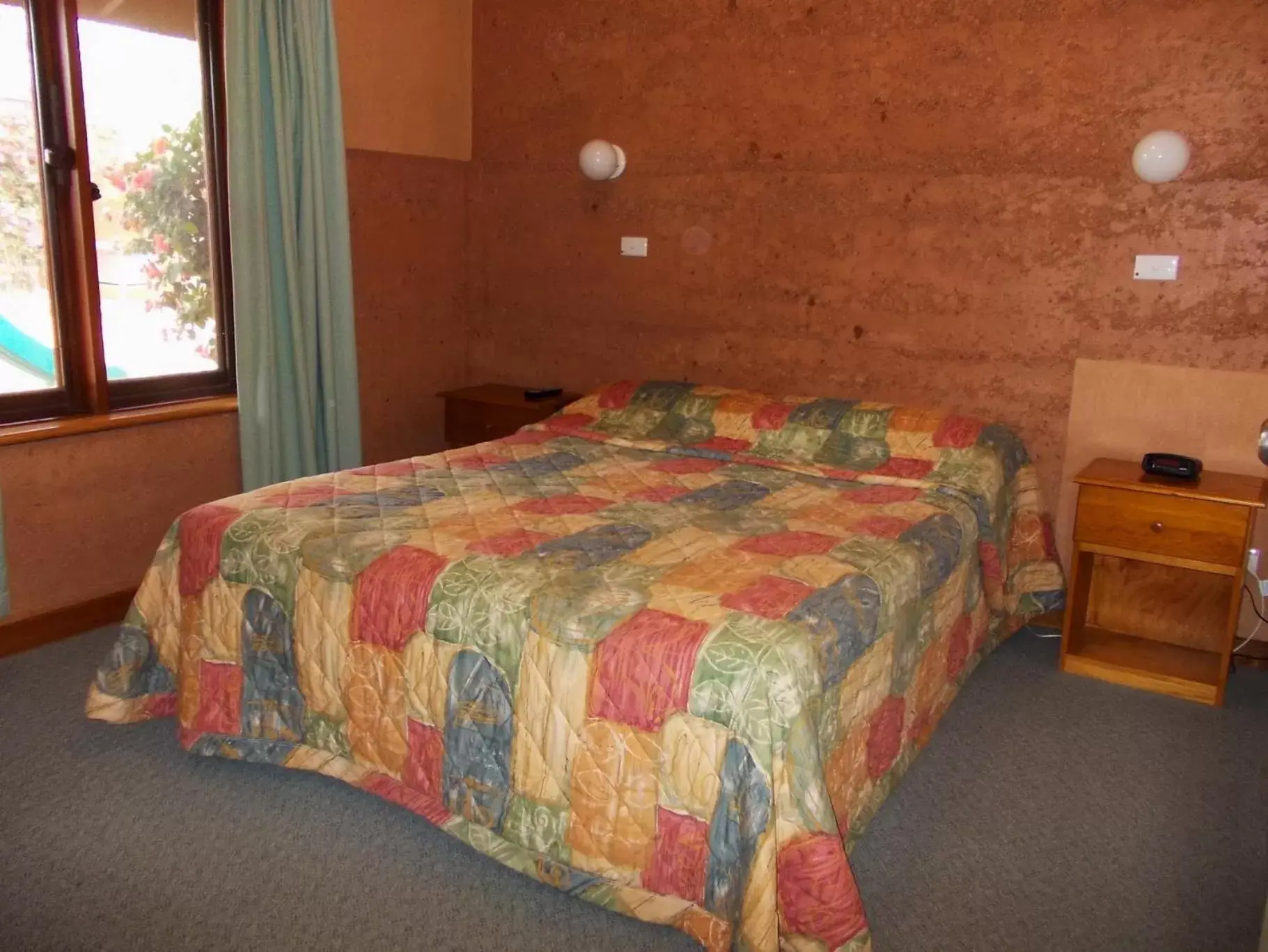 Bed in Mud Hut Motel