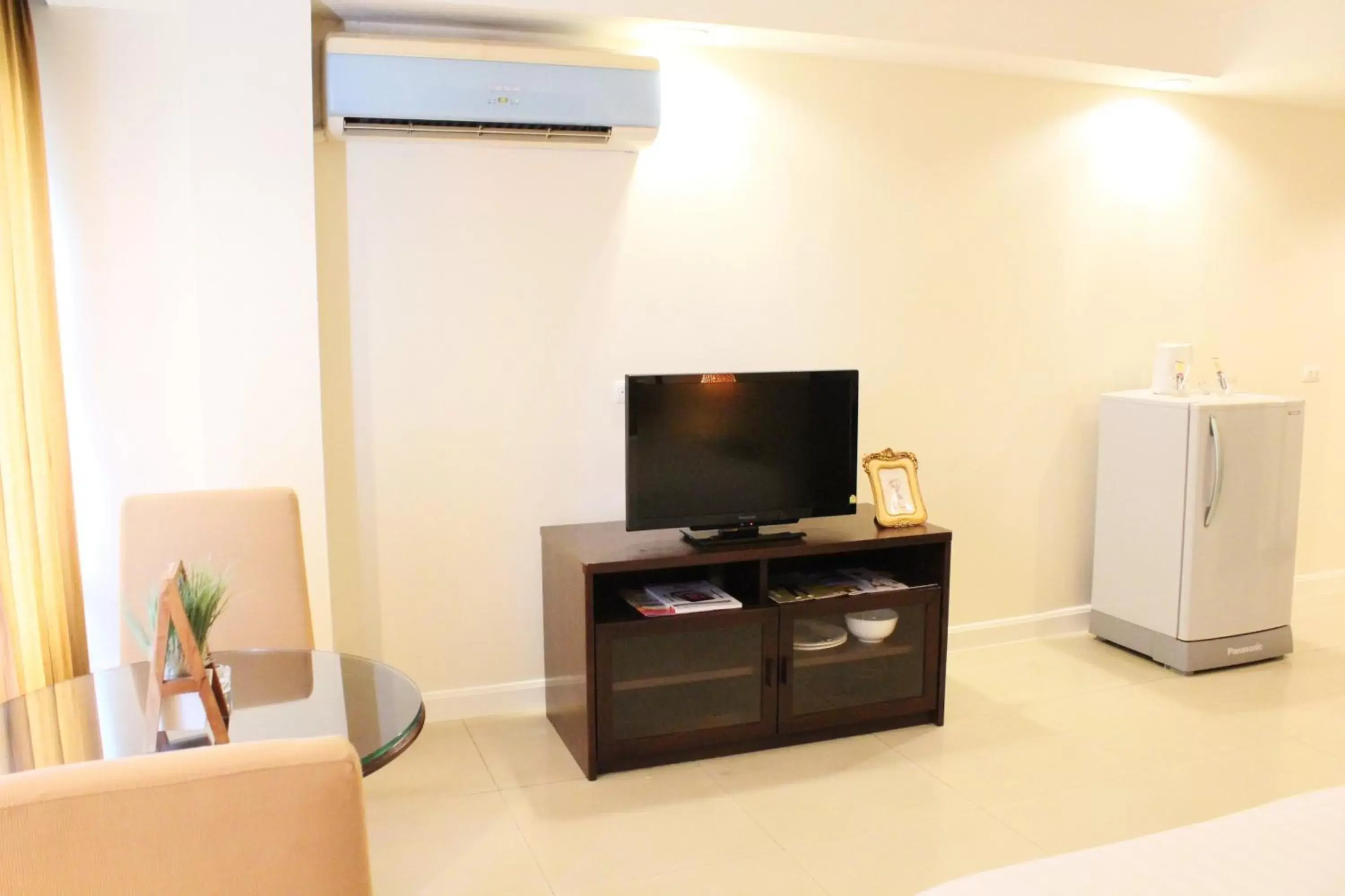 Photo of the whole room, TV/Entertainment Center in Romance Hotel Bangna