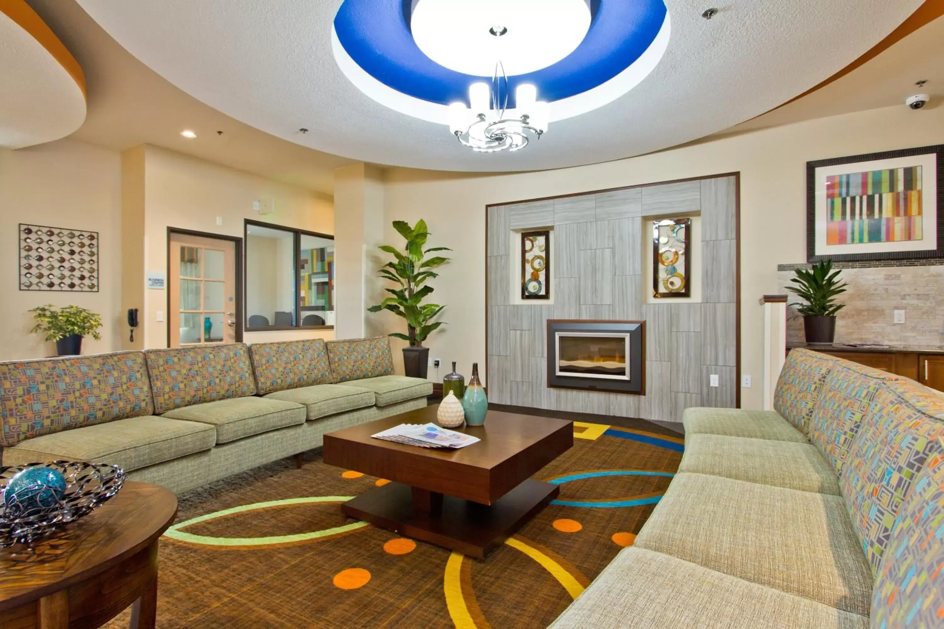 Property building, Seating Area in Holiday Inn Express and Suites Denver East Peoria Street, an IHG Hotel