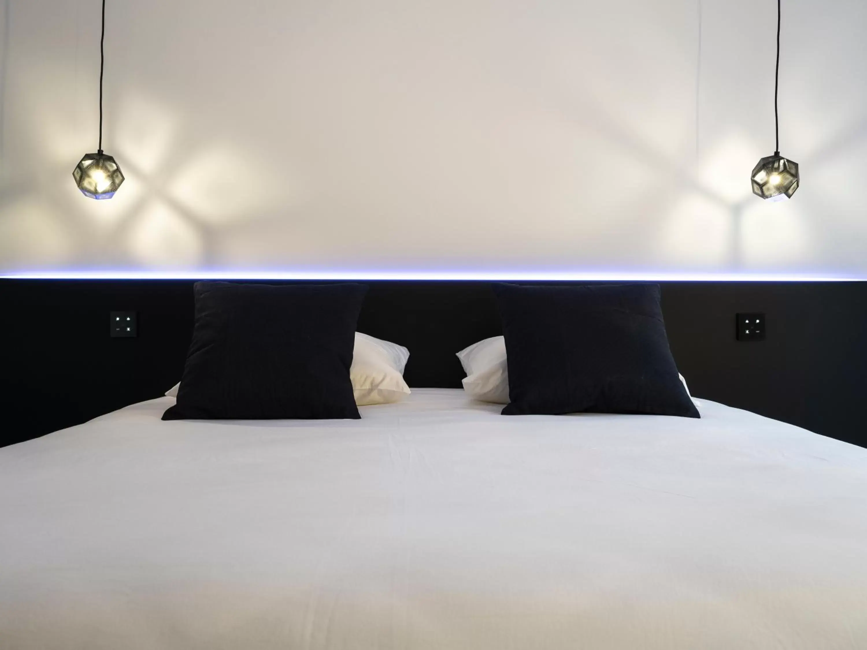 Bed in MiHotel Vieux Lyon