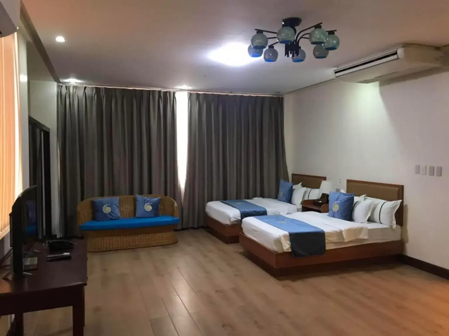 Bed in Costa Palawan Resort