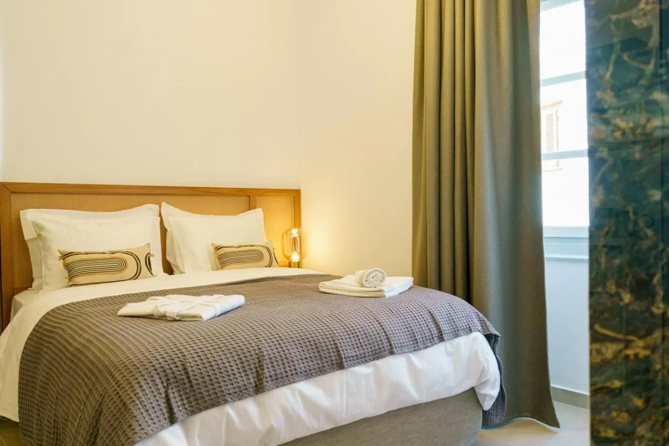 Bed in La Vie Hydra Luxury Suites