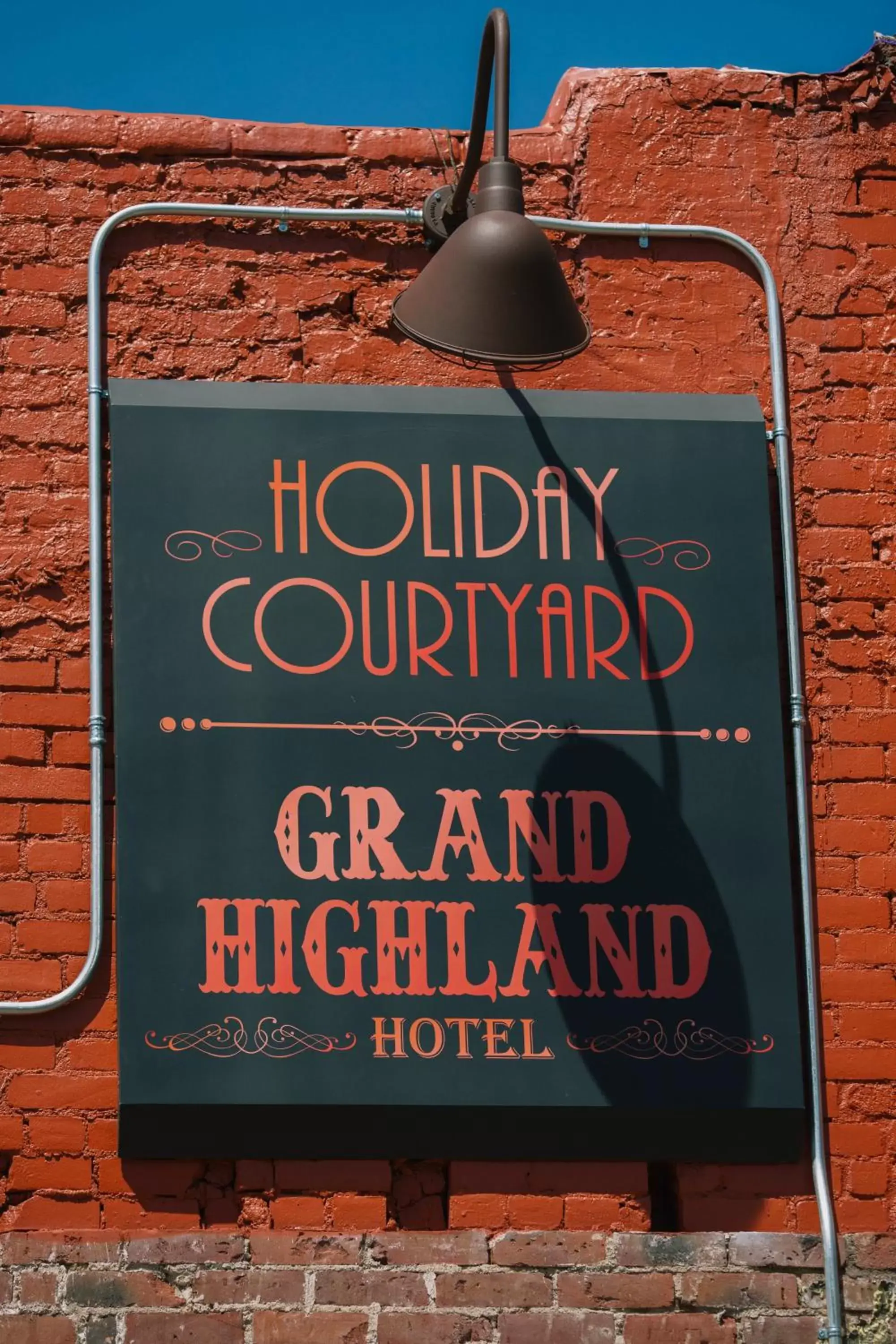 Property logo or sign in Grand Highland Hotel